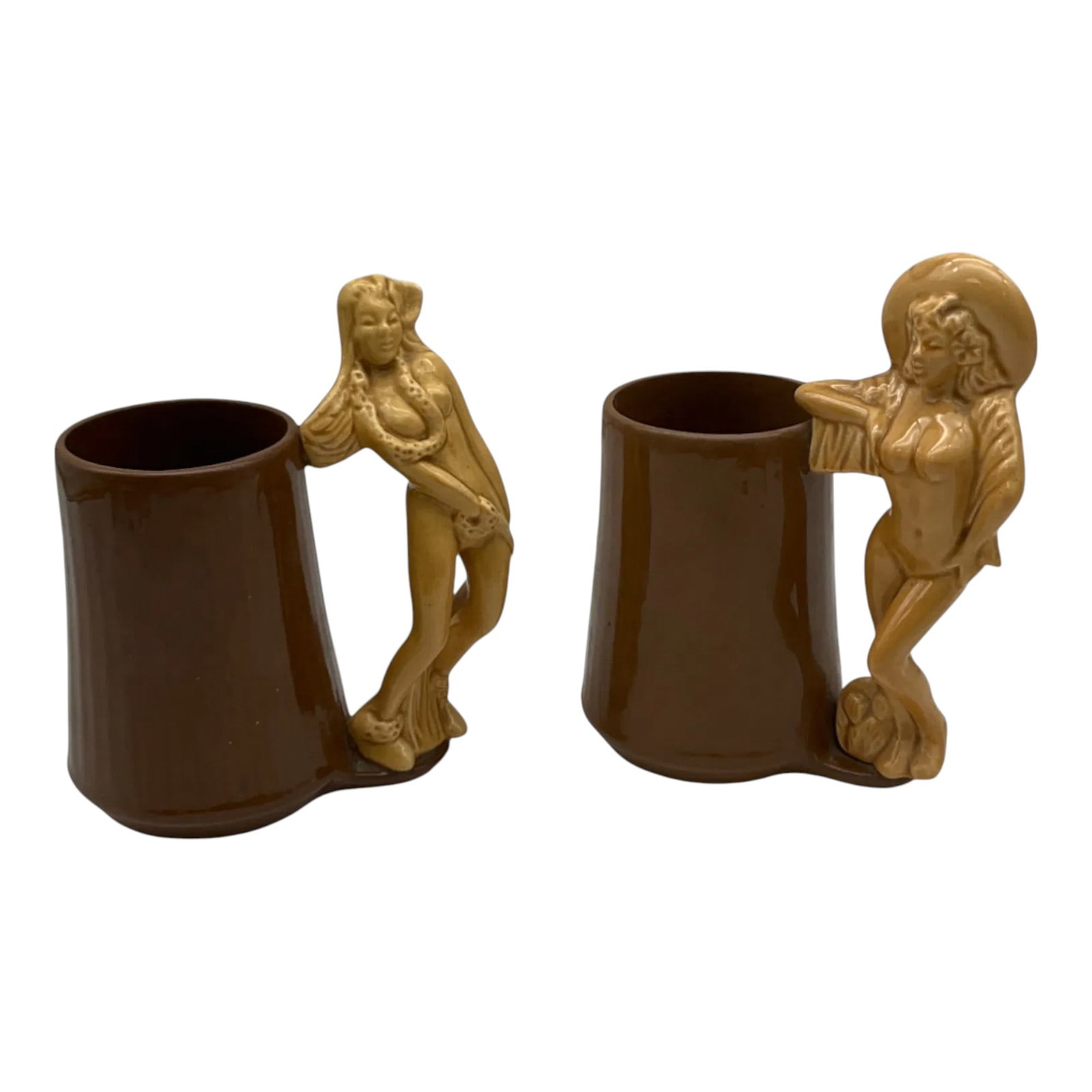 Pair Ceramic Tiki Mugs: Pair ceramic Tiki Mugs with cowgirl, hula girl and nude girl handles. Approx. 6 Inches tall x 4.5 wide x 3 deep, 2.4 lbs. together.