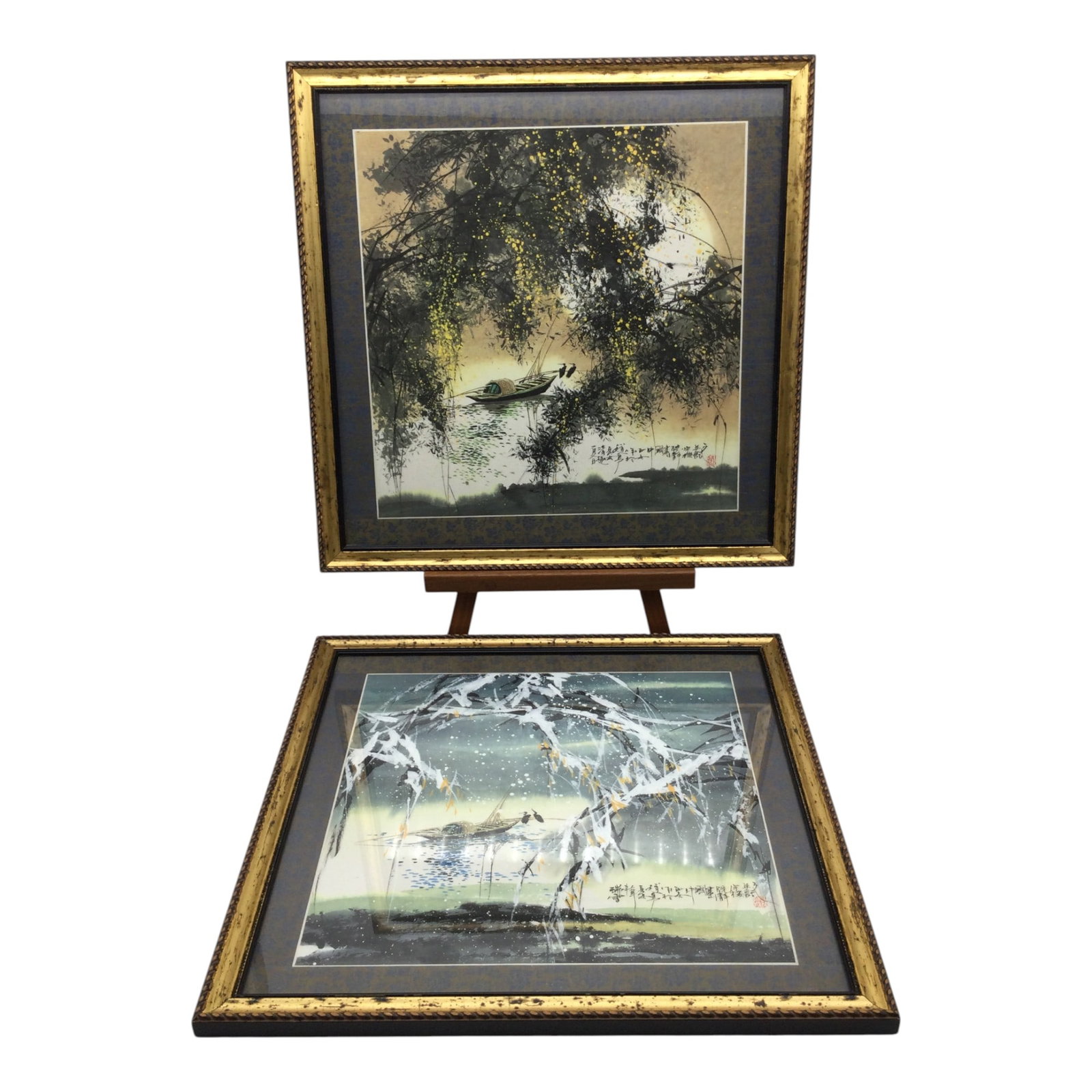 Pair Stamped Chinese Watercolor on Silk Border: Pair Stamped Chinese Watercolor on Silk Border depicting 2 seasons, winter and spring, with cranes on a fishing boat. Approx. 17.5 inches tall and wide.