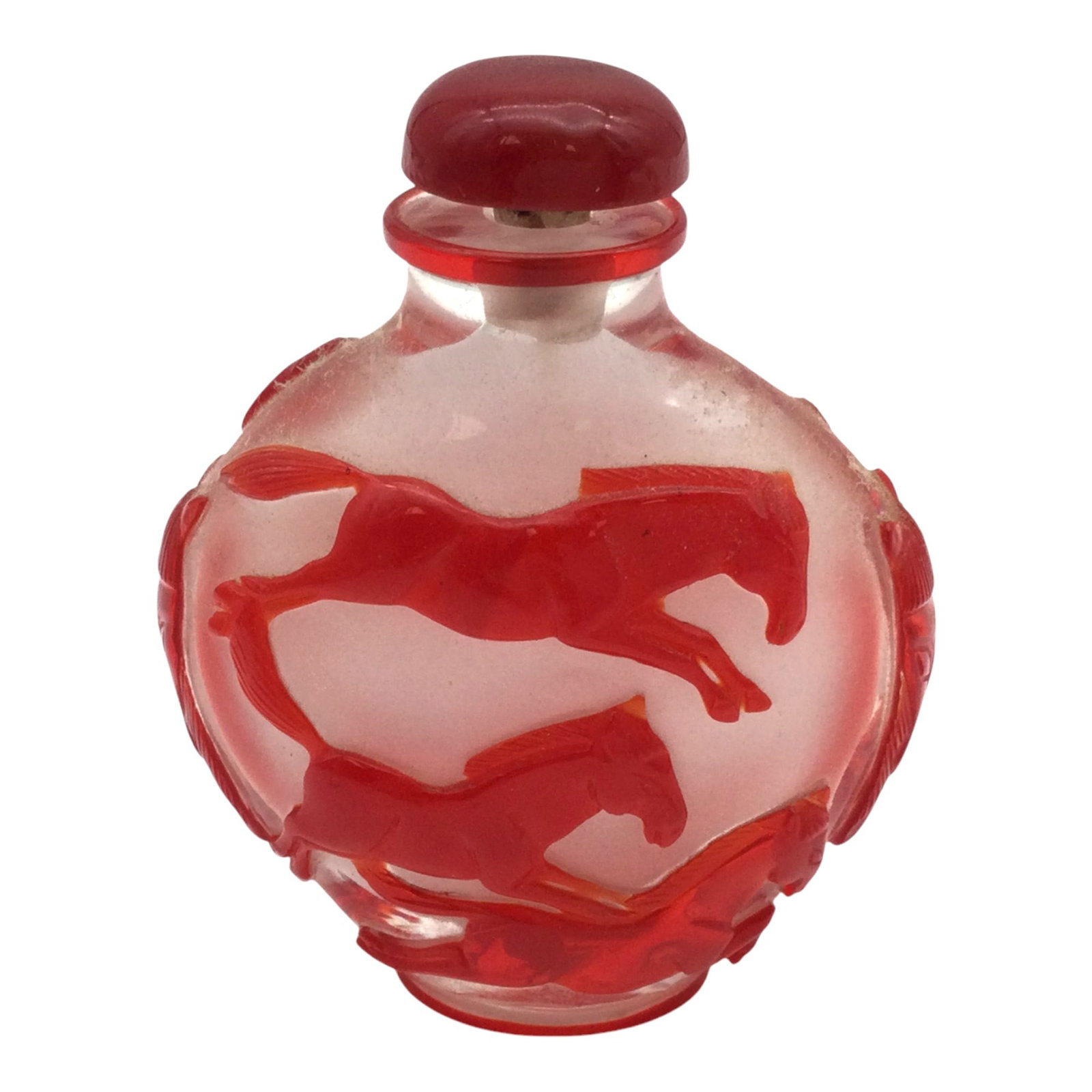 Red Peking Glass Snuff Bottle: CHINESE Glass overlay carved SNUFF BOTTLE with raised horses that are red on clear glass. Approx. 2.5 inches tall x 2.5 wide x 1.5 deep, 3.3 oz.