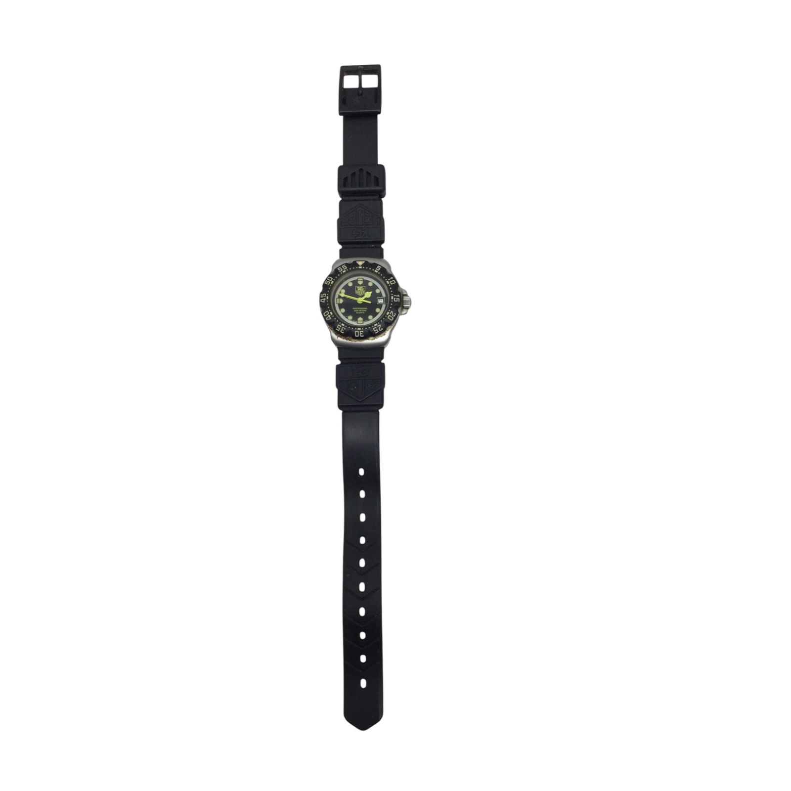 Tag Heuer Formula 1 Professional 200 Meter Quartz Watch: Tag Heuer Formula 1 Professional 200 Meter Quartz Watch with luminous hands and hour markers, a date window, and unidirectional rotating bezel with dive time scale, black rubber strap. Approx. 8 inch