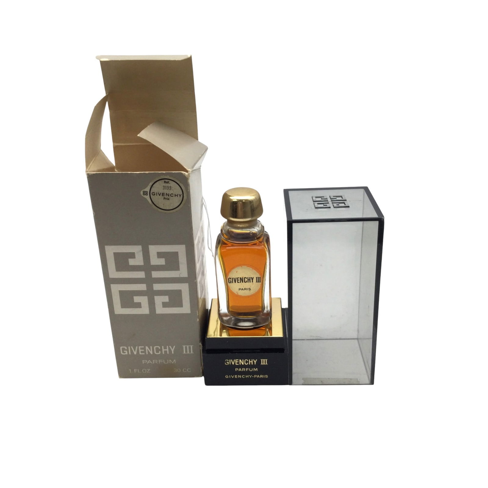 Vintage Givenchy III Parfum: Givenchy III Parfum 1 fl. ounce bottle. Approx. over 95% full. 5.5 inches tall x 2 wide.