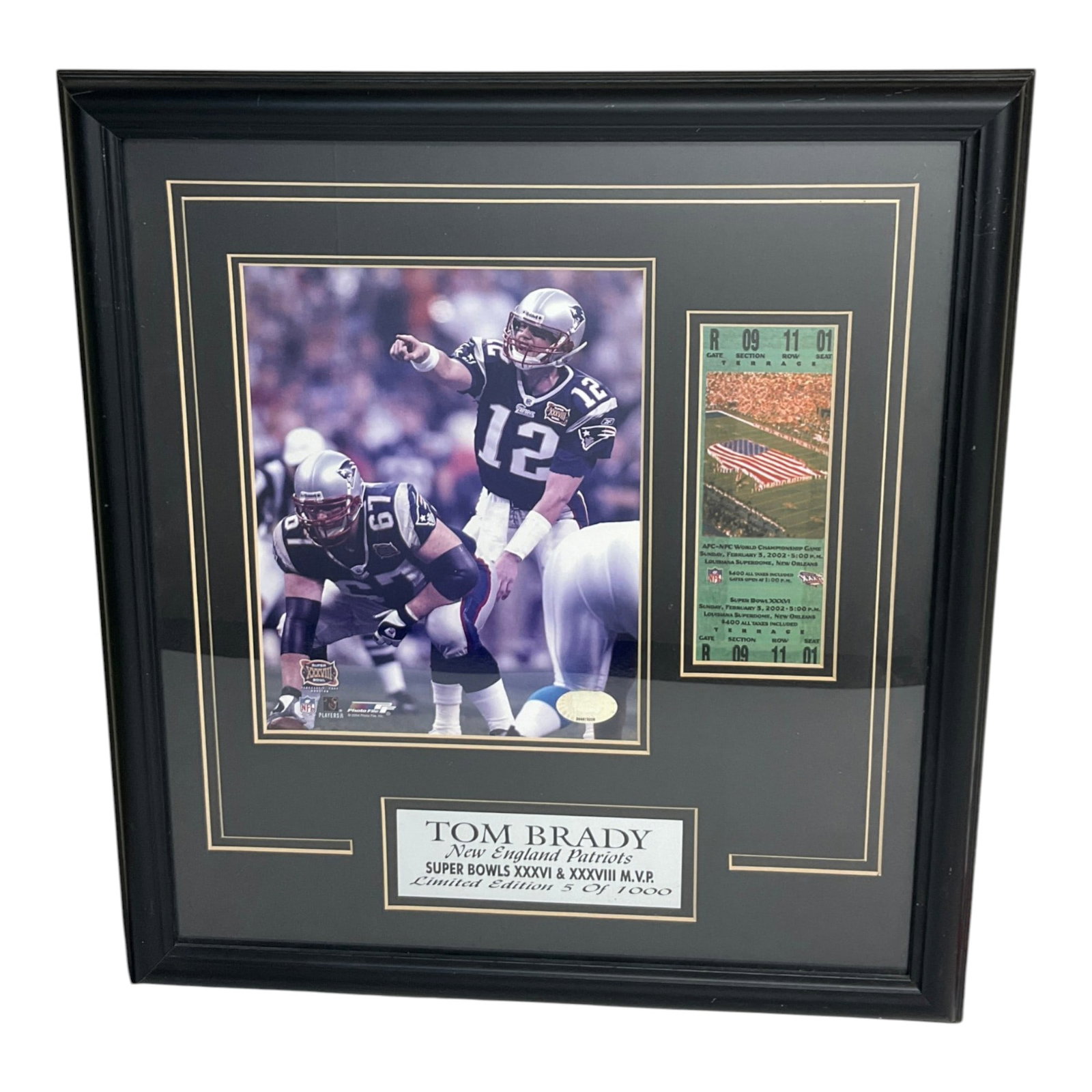 Tom Brady New England Patriots LE Super Bowl Photo: Tom Brady New England Patriots LE Super Bowl XXXVIII Photo in Houston, TX 2004 with authenticity sticker. This photo is with a replicated Super Bowl Ticket and plaque that states Tom Brady New