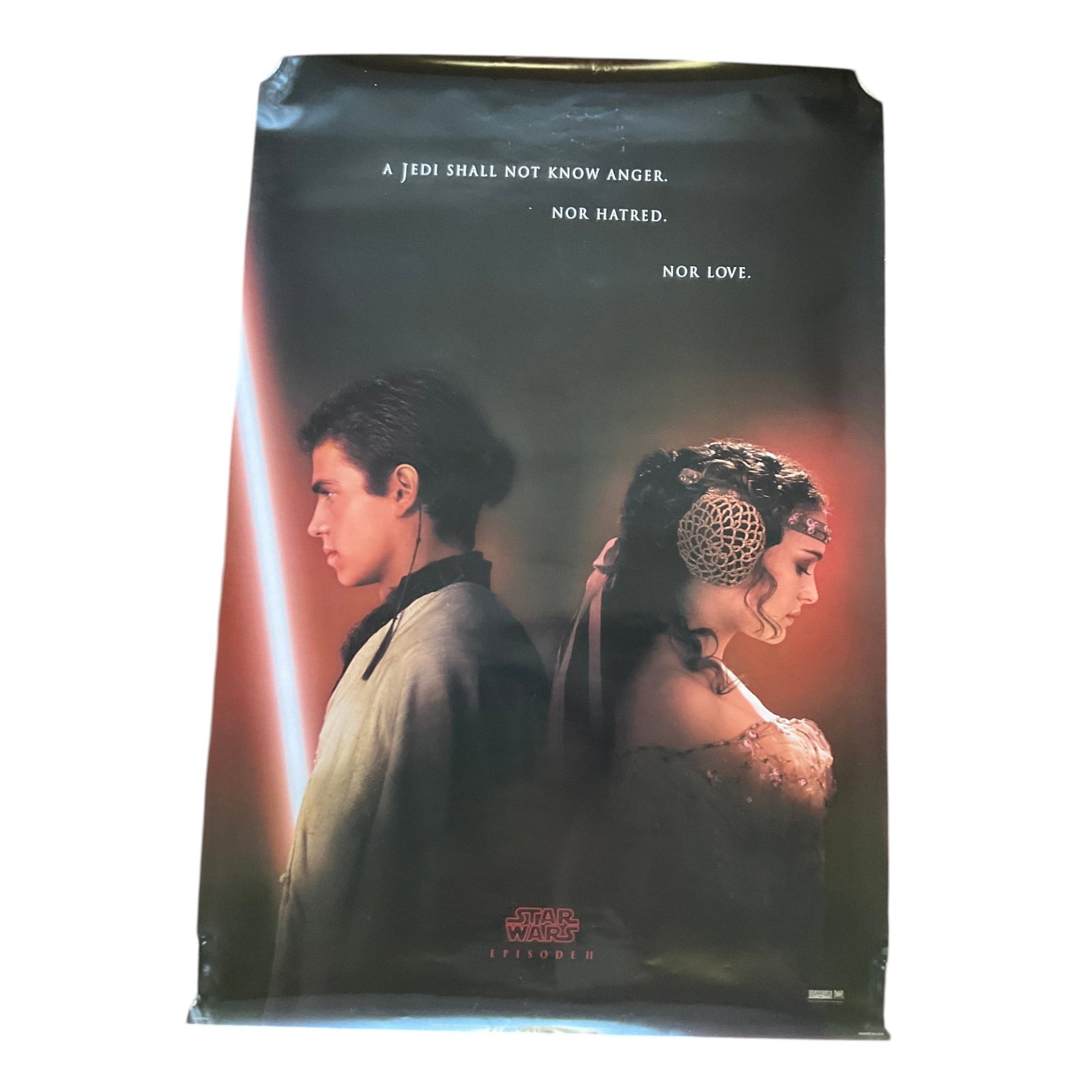 Star Wars Episode II Attack Of The Clones 2002 Teaser Poster: Star Wars Episode II Attack Of The Clones 2002 Teaser Poster with Anakin and Padme back to back. Approx. 40 inches tall x 27 wide.