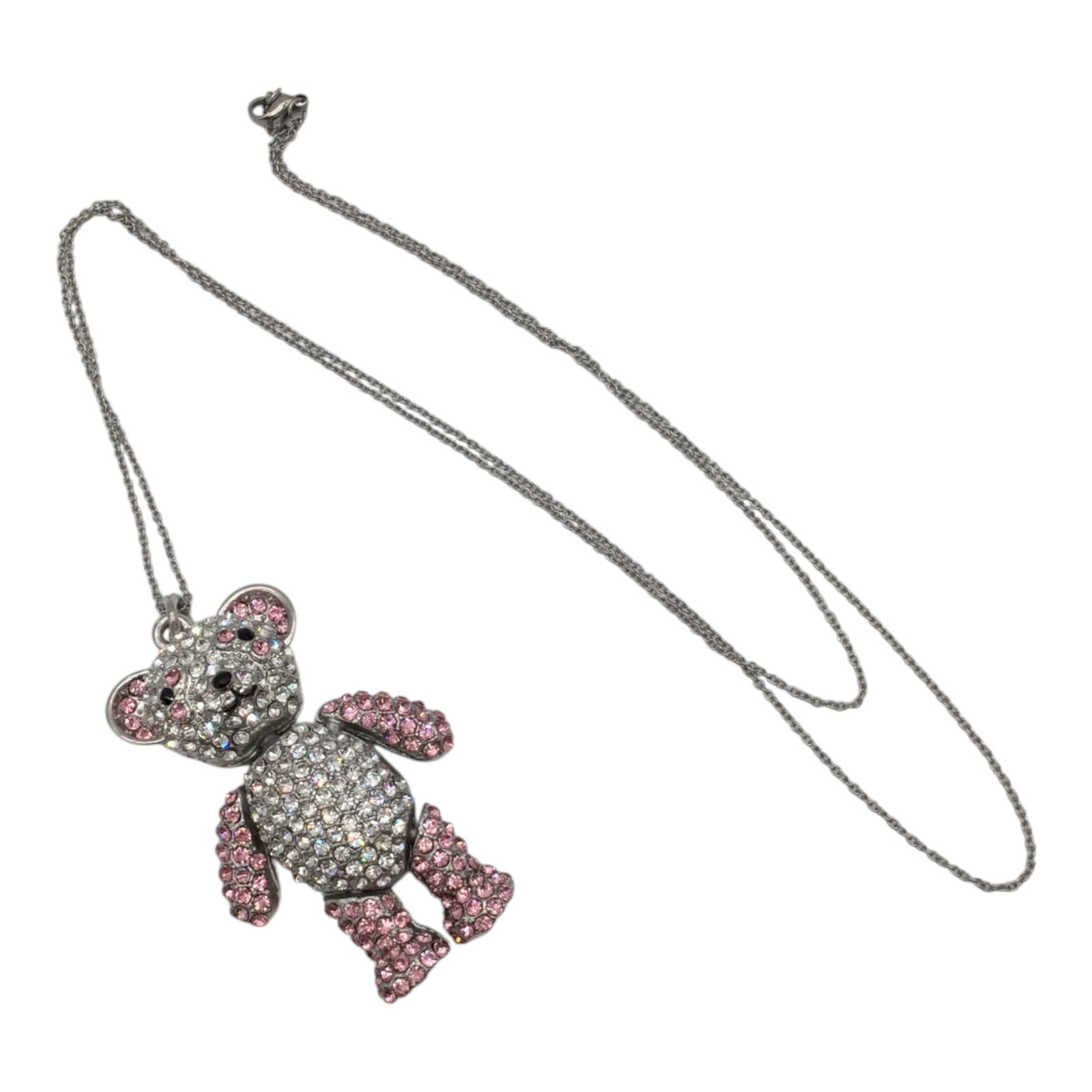 Articulated Rhinestone Teddy Bear Pendant on Silver Necklace: Articulated Pink and Clear Rhinestones Teddy Bear on Silver Necklace. Approx. 31 inches end to end, Necklace, 2.5 tall x 1.5 wide Pendant - 2 oz.