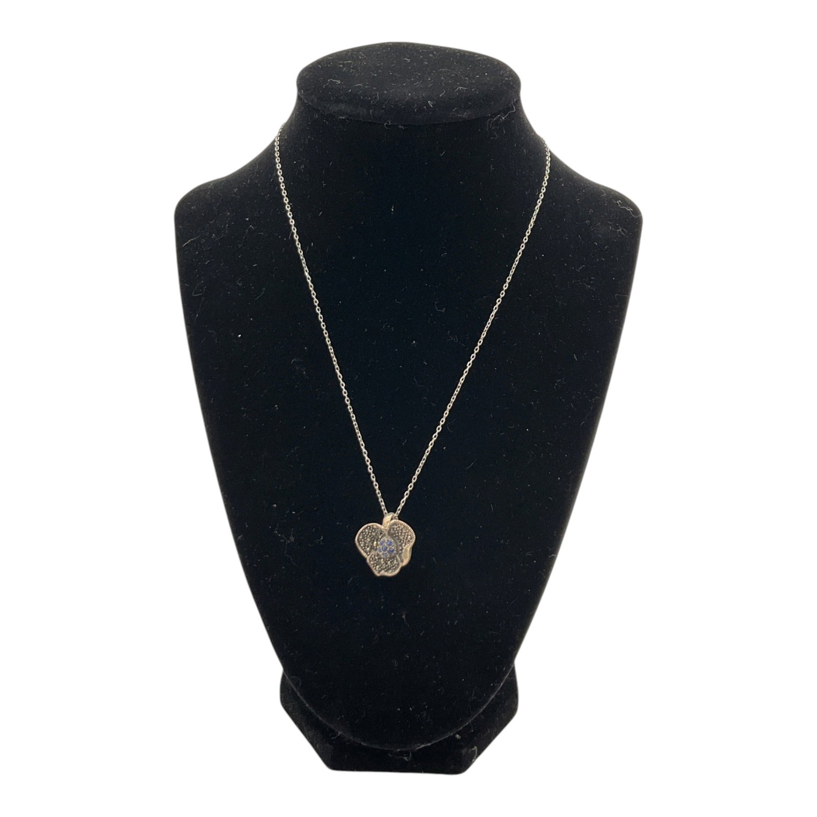 925 Italy Pendant and Necklace: Sterling Silver Marked A 925 blue and clear gemstone flower Pendant and marked 925 Italy silver chain Necklace. Approx. 16.75 inches end to end, (pendant) 0.75 across, 6 grams.