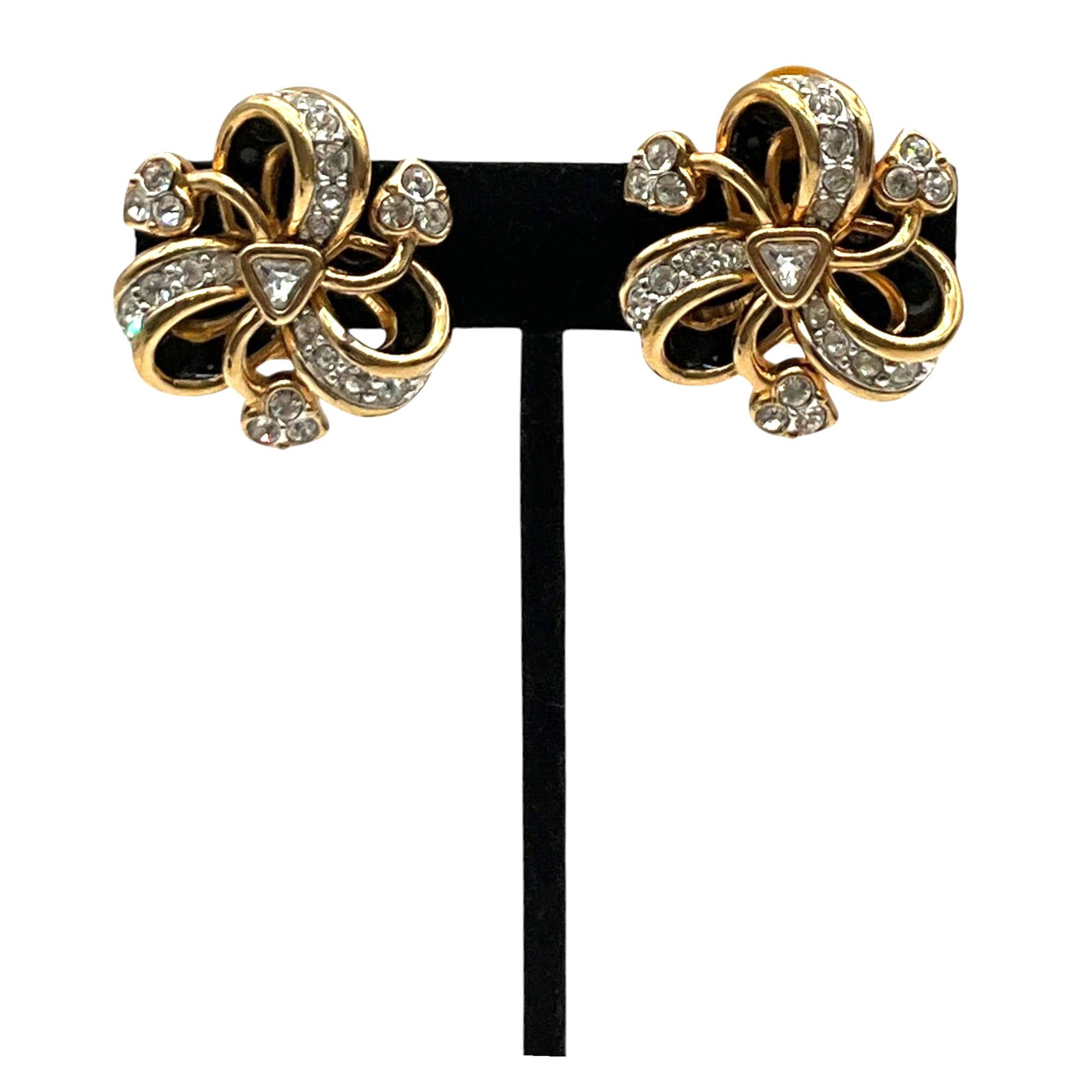 Swarovski RIbbon Bow Clip-on Earrings: Swarovski gold tone Ribbon Bow with black enamel and clear crystals Clip-on Earrings. Approx. 1 inch across.
