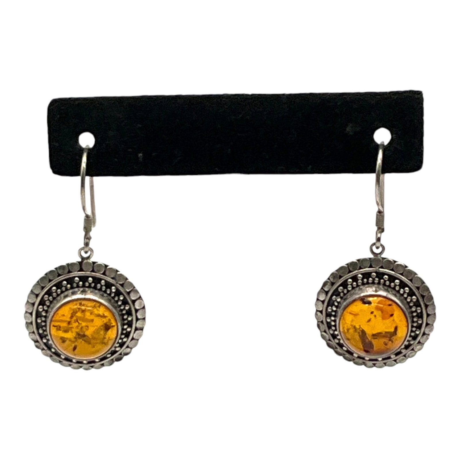 Marked 925 Sterling Silver and Amber Earrings: Marked 925 Sterling Silver and Amber shield hook Earrings. Approx. 1.5 inches tall x 1 wide.