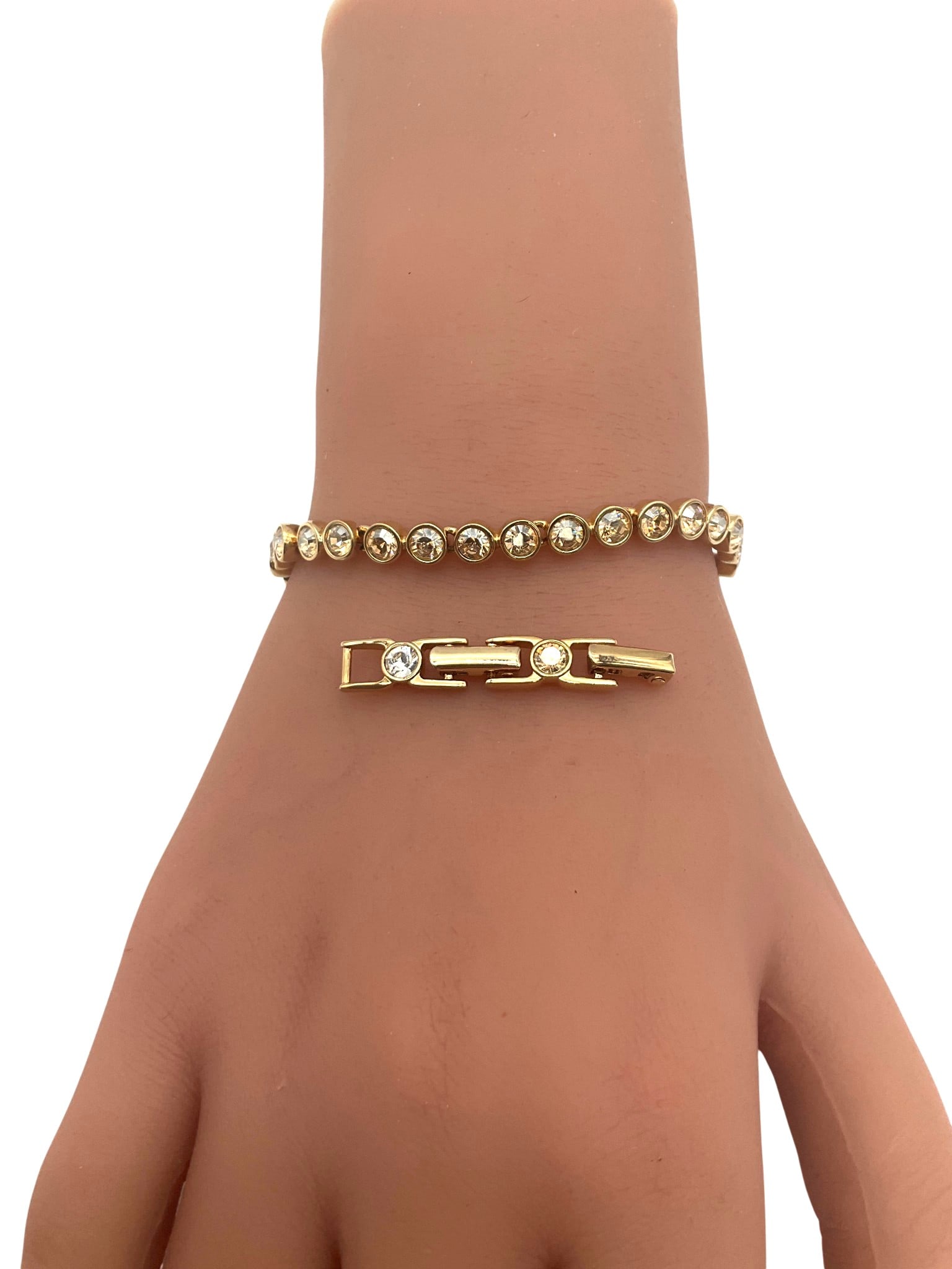 Swarovski Tennis Bracelet with Extension: Swarovski crystal and gold Tennis Bracelet with Extension. Approx. 6.5 - 8 inches end to end.