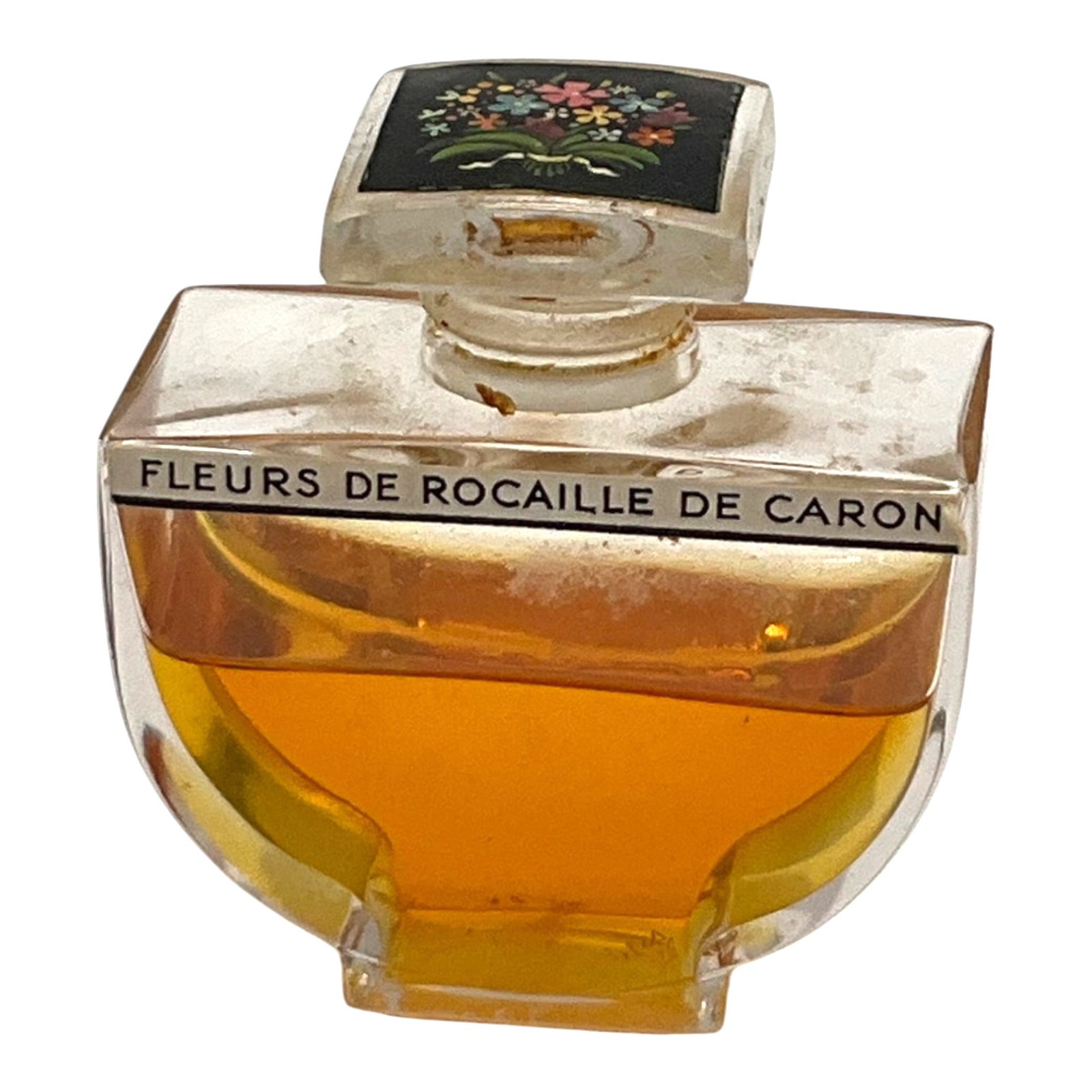 Vintage Caron Fleurs de Rocaille Parfum: Vintage Caron Fleurs de Rocaille Parfum 1.056 oz. bottle. Approx. 50% full. 2.25 inches tall x 2 wide x 1 deep.