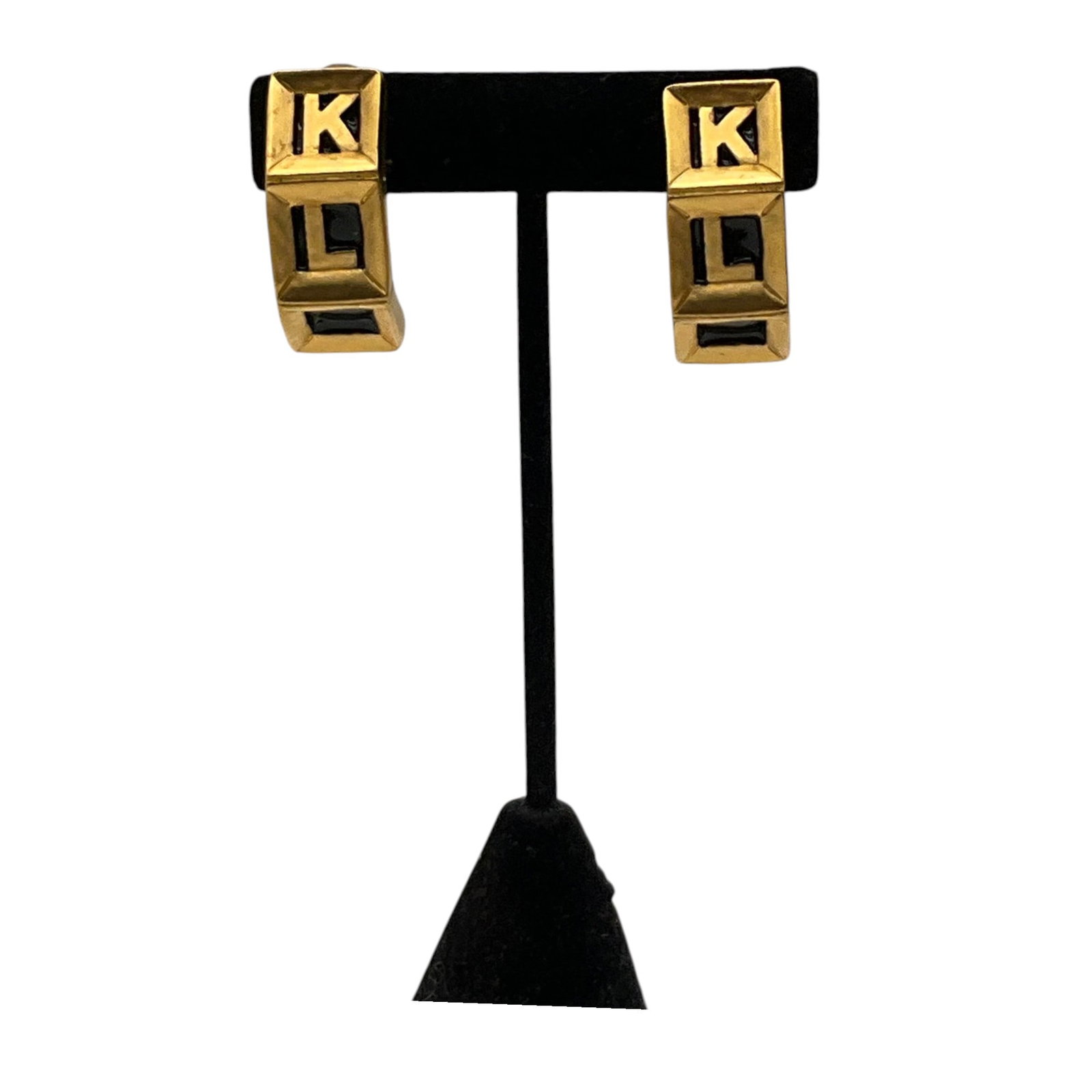Karl Lagerfeld Enamel Clip-on Earrings: Karl Lagerfeld gold tone with brand logo on black Enamel Clip-on Earrings. Approx. 1.25 inches tall x 0.5 wide x 0.5 deep.