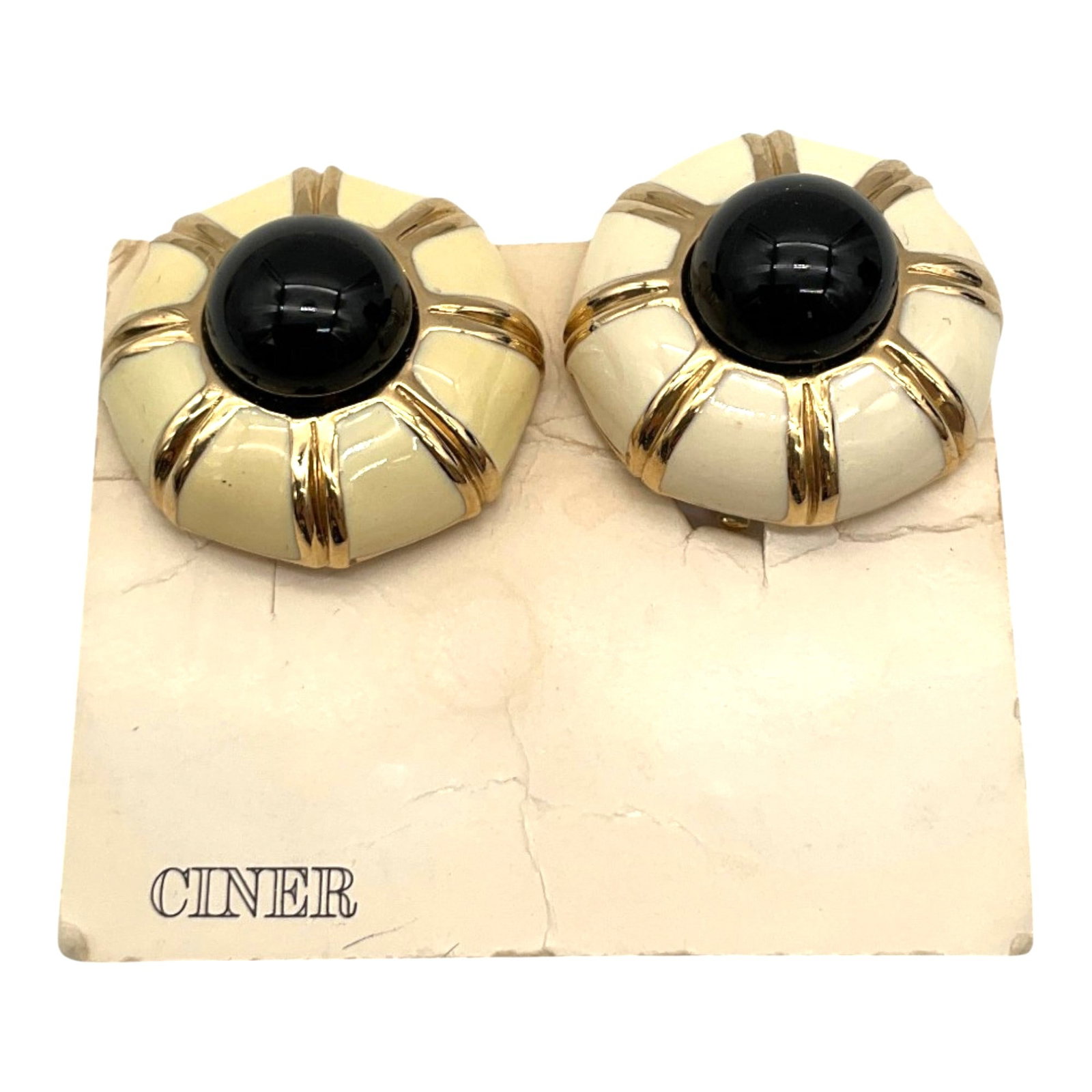 Vintage Ciner Enamel Clip-on Earrings: Vintage Ciner cream Enamel Clip-on Earrings with Faux Black onyx cabochon. Approx. 1.25 inches across.