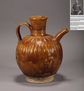 Tang Dynasty yellow glaze ewer: H: 7 7/8 in(20cm) W: 6 3/4 in(17cm)