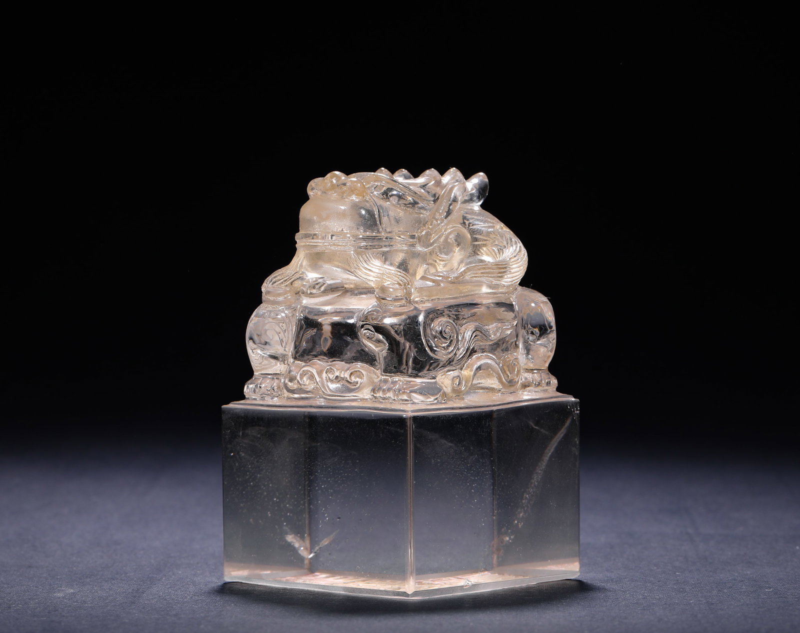 QING DYNASTY CRYSTAL AUSPICIOUS BEAST KNOB SQUARE SEAL: H:9cm (3.54in) W:5.6cm (2.20in) Weight:530g (1.17lb)Carved from a single whole crystal stone. It features a regular square seal base, with a recumbent auspicious beast sculpture on the knob.