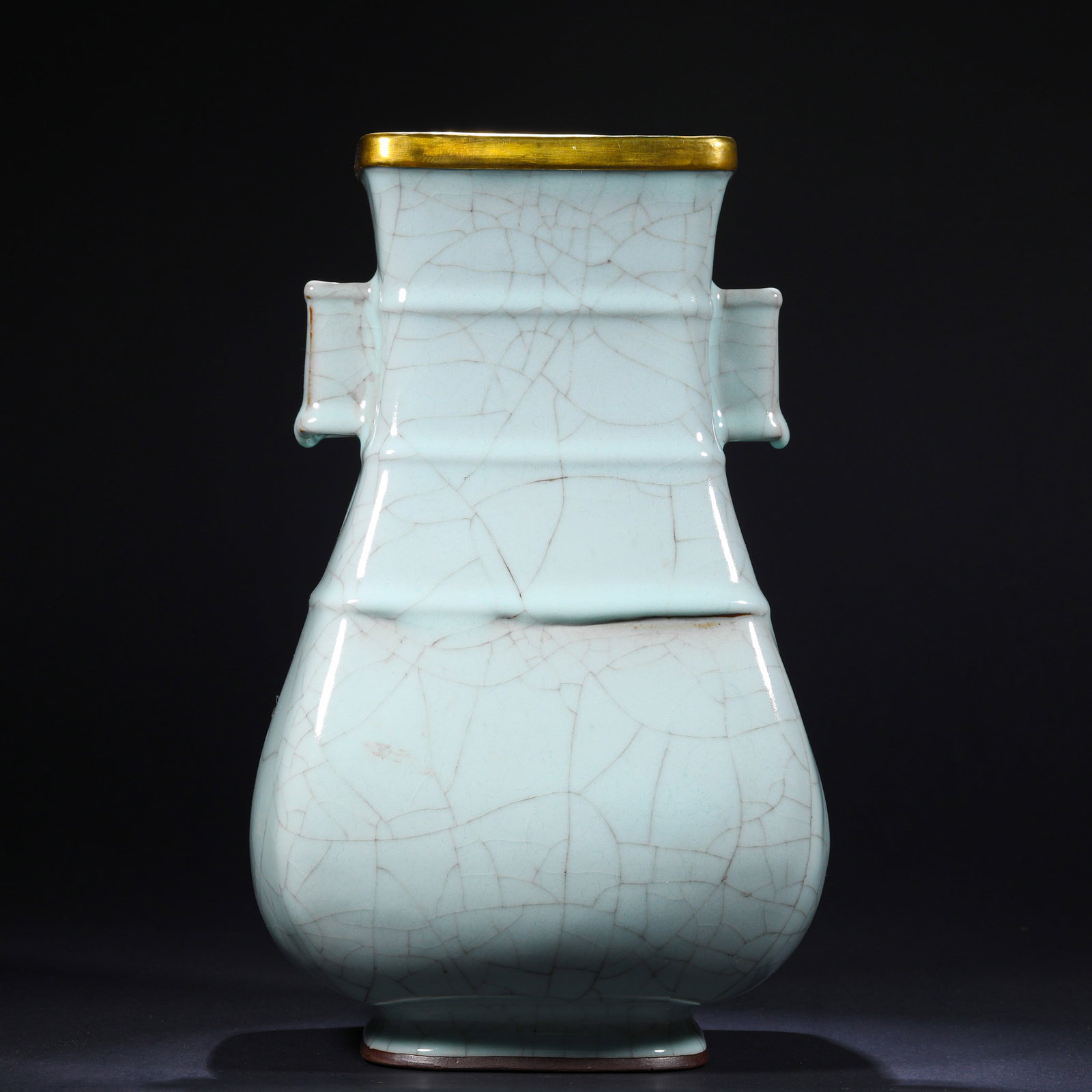 SOUTHERN SONG DYNASTY OFFICIAL KILN POWDER BLUE GLAZE THROUGH-EAR VASE: H:30cm(11.81in)W:17cm(6.69in) This Southern Song Guan kiln pear-green glaze guan'er vase, with its warm pear-green glaze, intricate crackle patterns, and gilded rim, is a typical example of Song Dynas