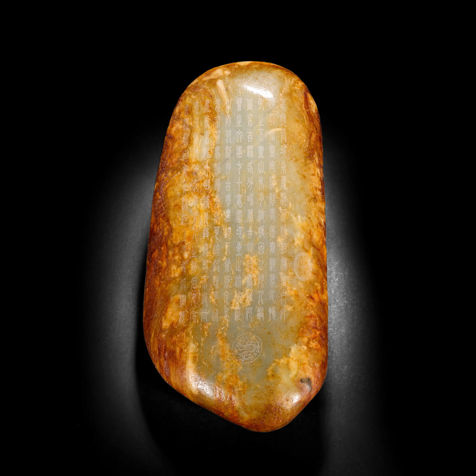 A PIECE OF HETIAN JADE SEED MATERIAL ENGRAVED WITH POETRY AND PROSE ON THE SKIN FROM THE QING: H:32.0cm(12.60in) W:15.0cm(5.91in) Weight:8310g(18.32lb)This hand piece is carved from a raw Hetian jade stone, fully retaining the natural red skin ??? (color infiltration). The jade is warm and fine