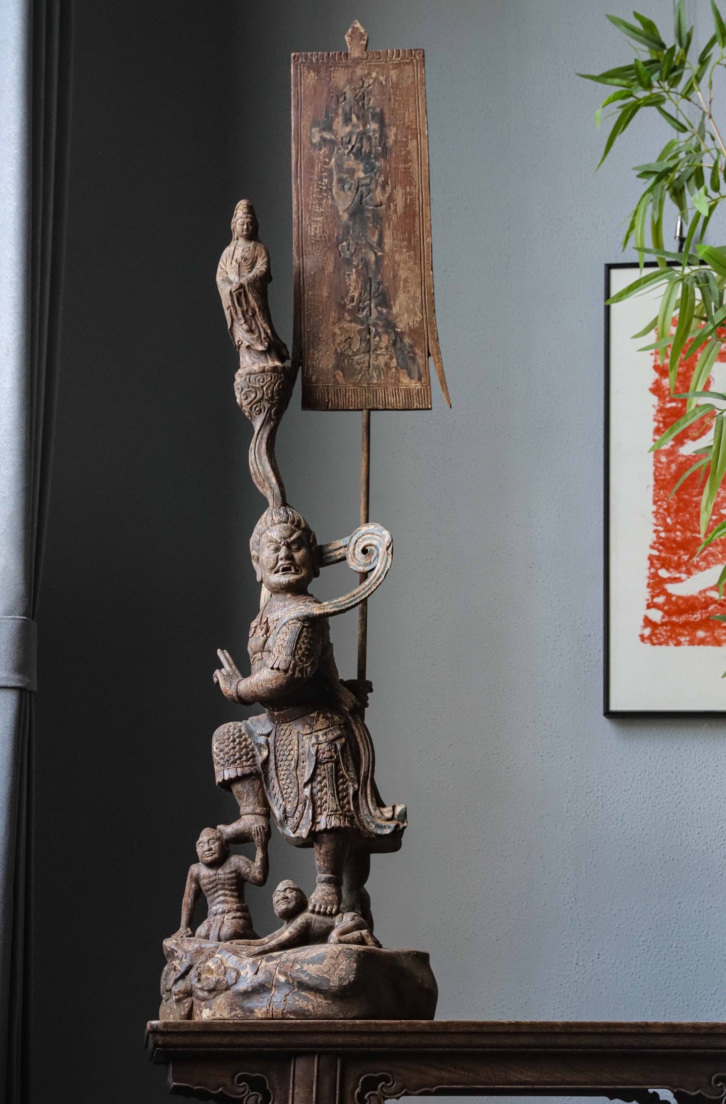 IN THE MING DYNASTY, A STATUE OF BODHISATTVA WAS BURNED ON A CAMPHOR WOOD SURFACE: H:118cm(46.46in)H:96cm(37.80in)W:30cm(11.81in)T:28cm(11.02in)It stands tall and powerful with a ferocious scowling face and bared teeth, presenting a majestic deterrent aura. Wearing armor with distin