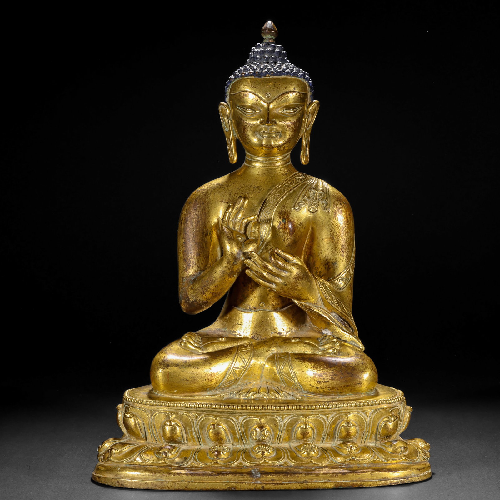 A GILDED BRONZE SEATED STATUE OF SAKYAMUNI BUDDHA FROM THE MING DYNASTY (1 of 12)