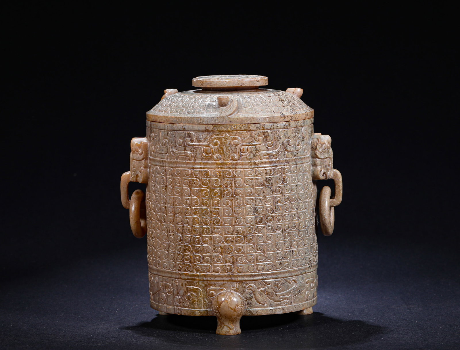 ANCIENT HAN DYNASTY JADE MANGRAIN-PATTERNED ANIMAL HEAD WITH A RING: H:14cm(5.51in) W:9cm(3.54in) Weight:590g(1.30lb)This is an ancient jade three-footed covered jar with full grain patterns and beast-head ring handles, featuring bluish-brown calcified jade and exquisi