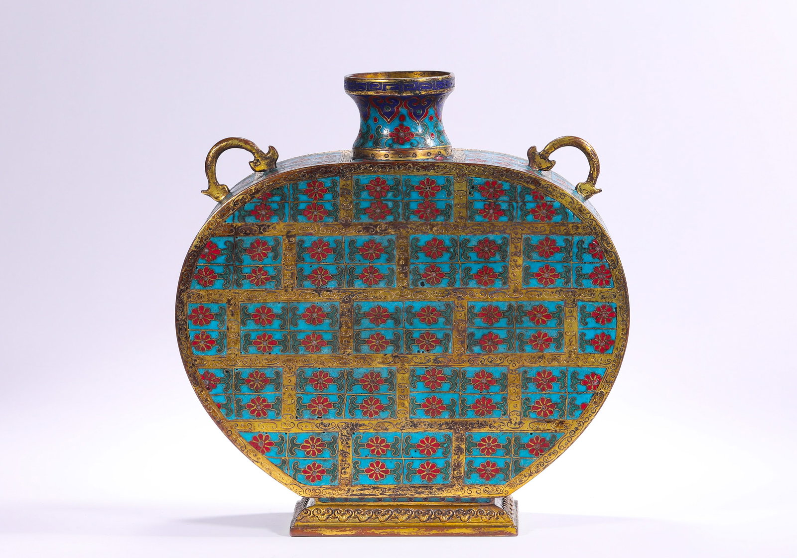 QING DYNASTY COPPER-BODIED CLOISONNE DOUBLE-EARED FLAT BOTTLE WITH LOTUS PATTERN: H:23.0cm(9.06in) W:22.3cm(8.78in) Weight:2340g(5.16lb)This vase is a top-tier palace cloisonné vessel of the Qing Dynasty, made of bronze with full-body cloisonné enamel craftsmanship. It features t