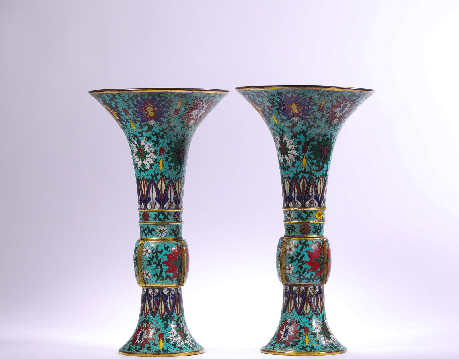 QING DYNASTY CLOISONNE CLOISONNE LOTUS PATTERN ON COPPER BODY ?: H:34.5cm(13.58in) D:18.8cm(7.40in) Weight:3820g(8.42lb)This pair of Gu vases is a top-tier palace cloisonné vessel of the Qing Dynasty, made of bronze with full-body cloisonné enamel craftsmanship. 