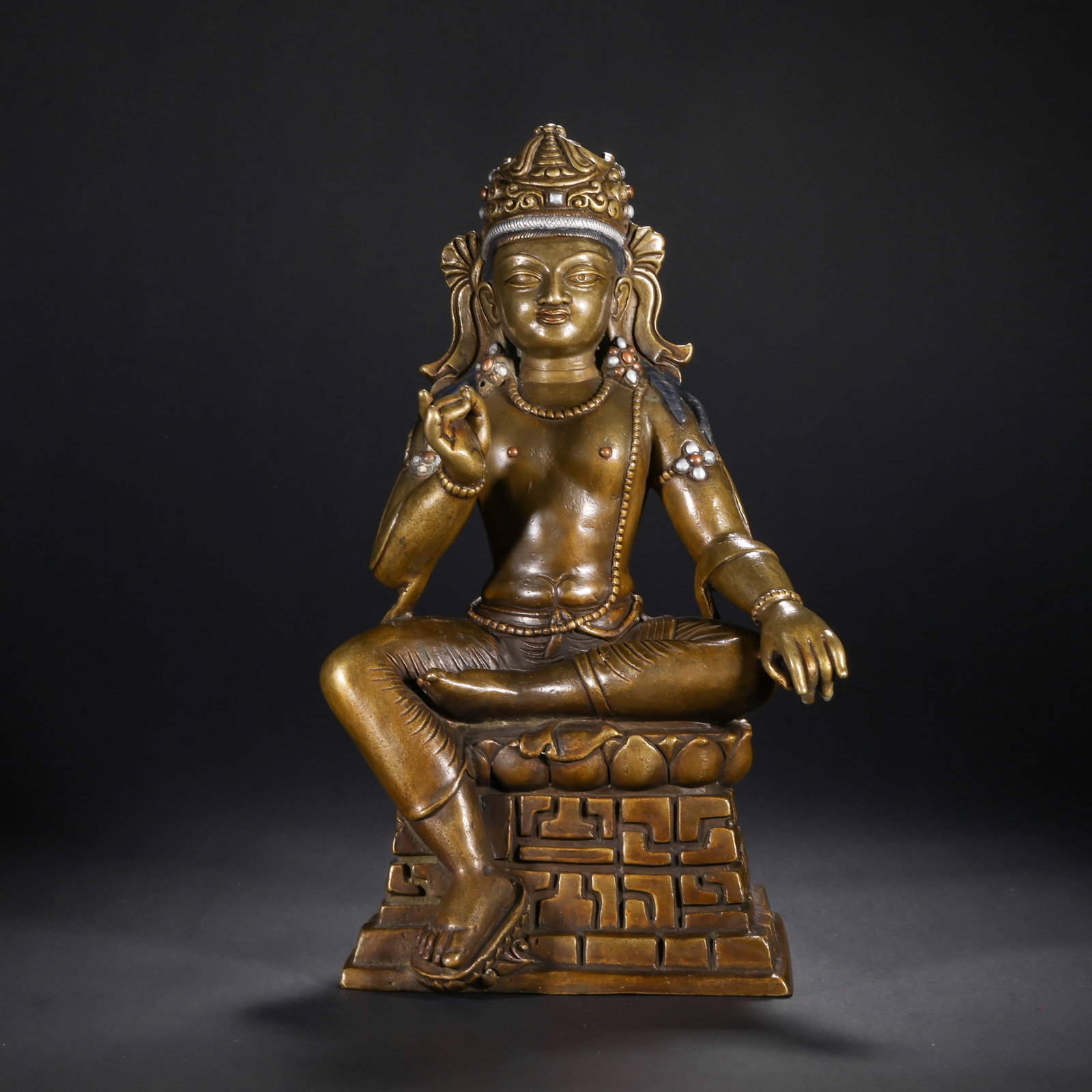 QING DYNASTY ALLOY COPPER INLAID WITH SILVER, TURQUOISE TIBETAN-STYLE BUDDHA MOTHER, TARA SITTING: H:32.0cm(12.60in) W:17.0cm(6.69in) Weight:3990g(8.80lb)This statue is cast in alloy copper, sitting in a relaxed (lalitasana) posture on a square base. It wears a treasure crown with a compassionate e