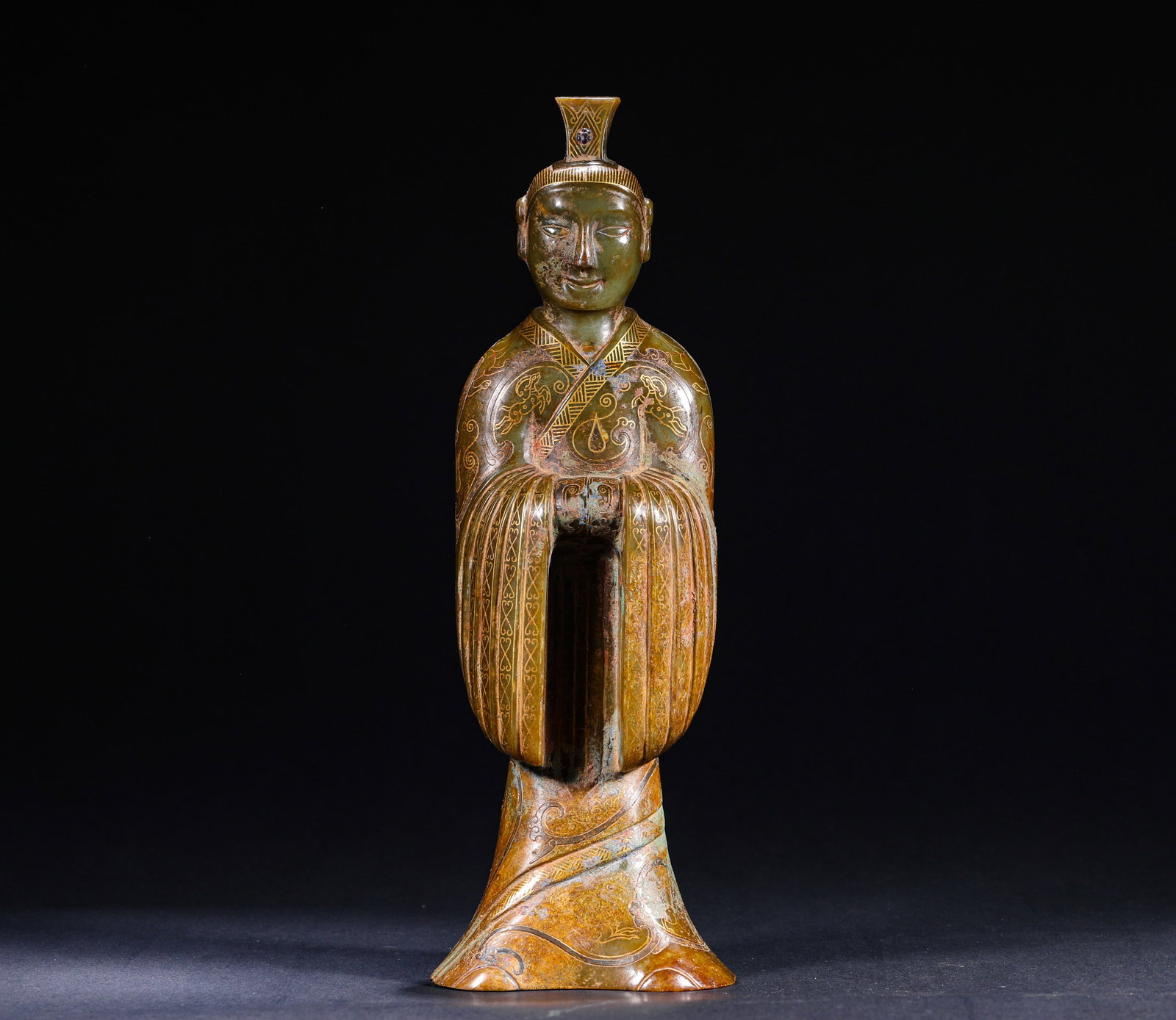 ANCIENT HAN DYNASTY JADE FIGURE INLAID WITH GOLD AND GEMSTONES: H:33cm(13.00in) W:10cm(3.94in) Weight:2950g(6.50lb)This is an ancient jade standing figure ornament with gold inlay and gemstone inlay, featuring calcified jade, exquisite gold-inlay craftsmanship and