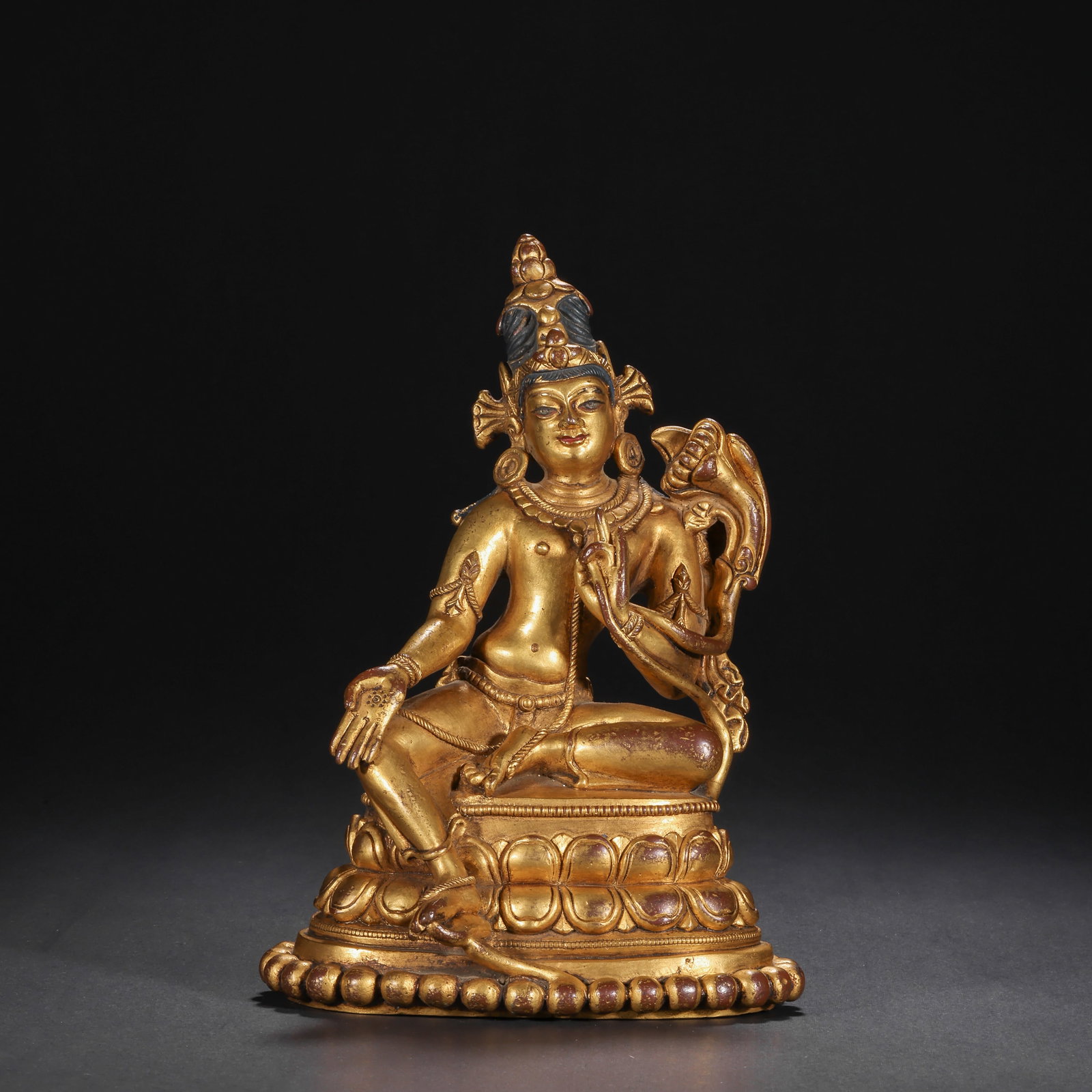 BRONZE GILDED GREEN TARA SEATED FIGURE OF THE QING DYNASTY: H:17.5cm(6.89in) W:12.5cm(4.92in) Weight:1180g(2.60lb)This statue is cast in bronze and gilded. Green Tara sits in a relaxed (lalitasana) posture on a lotus pedestal, wearing a treasure crown and body