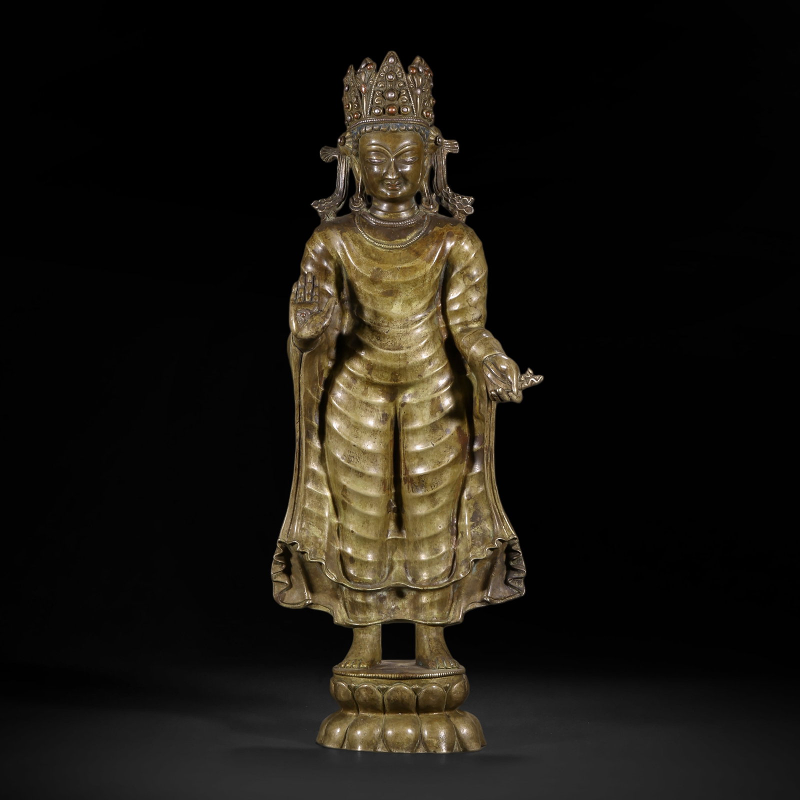 BRONZE SAKYAMUNI BUDDHA FROM THE QING DYNASTY: H:46.0cm(18.11in) W:17.0cm(6.69in) Weight:450g(0.99lb)This statue is cast in bronze. The main figure stands on a lotus pedestal, wearing a five-leaf treasure crown with a compassionate and solemn expr