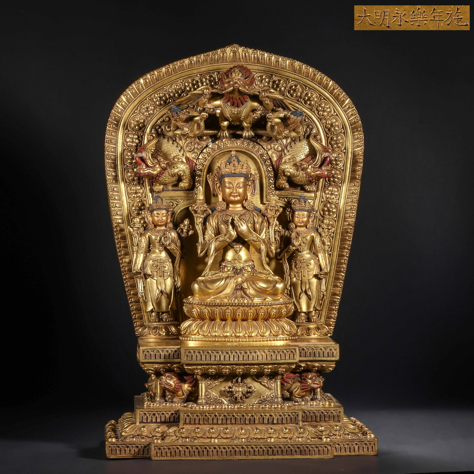 THREE GILDED BRONZE STATUES OF MANJUSRI BODHISATTVA FROM THE MING DYNASTY: H:44.0cm(17.32in) W:29.5cm(11.61in) Weight:12850g(28.33lb)This statue is cast in bronze and gilded. The main figure Manjushri Bodhisattva sits in lotus position on a lotus pedestal, wearing a treasure