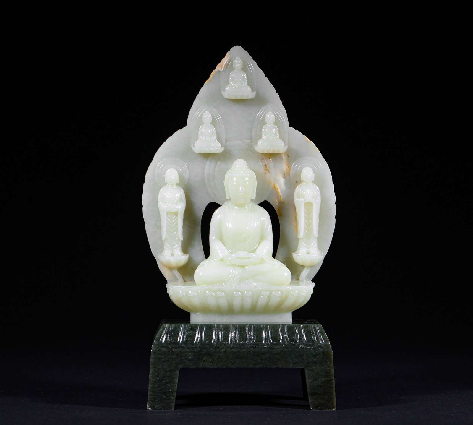A BACKLIT STATUE OF ONE BUDDHA AND TWO DISCIPLES IN HETIAN WHITE JADE OF THE TANG DYNASTY: H:27cm (10.63in) W:14cm (5.51in) Weight:1350g (2.98lb)Integrated openwork carved from single jade stone. The main Buddha Sakyamuni sits cross-legged on the lotus platform with merciful and solemn appe