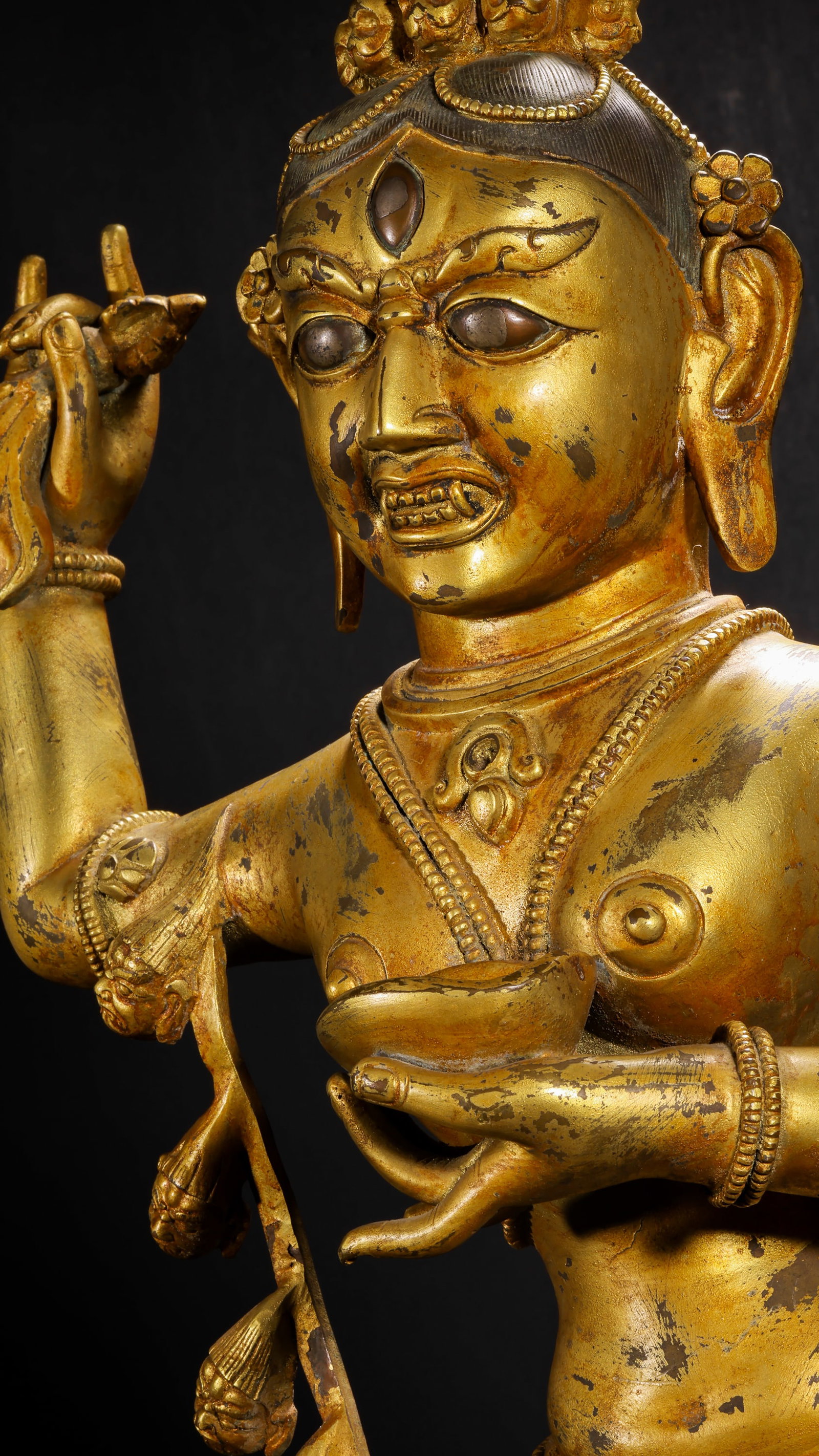 QING DYNASTY GILDED BRONZE VAJRA MOTHER STATUE: H:83cm(32.68in) W:39cm(15.35in) Weight:17000g(37.48lb)This statue is cast in bronze and gilded. Vajravarahi stands in a dancing posture on a lotus throne, wearing a precious crown with a third eye on 
