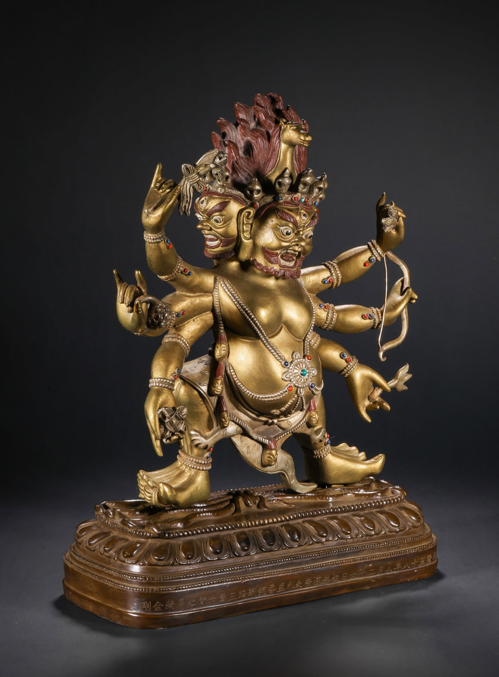 A GILDED BRONZE STATUE WITH A HORSE'S HEAD AND A VAJRA IN THE QING DYNASTY: H:36.0cm(14.17in) W:25.5cm(10.04in) Weight:7500g(16.53lb)This statue is cast in bronze with gilding, depicting Hayagriva (Dharma King Horse Head), one of the important deities in Tibetan Buddhism, sym