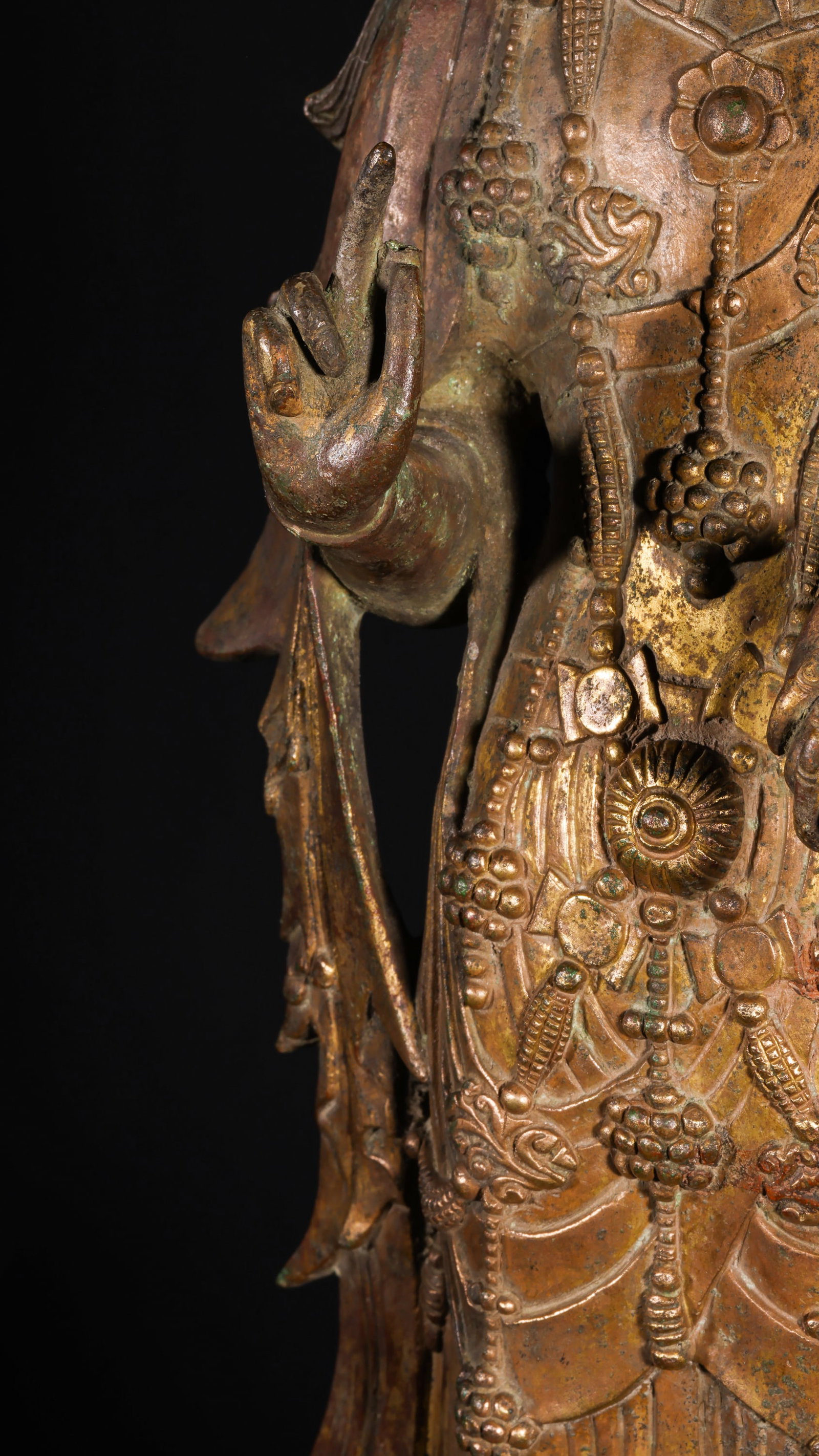 A GILDED BRONZE STATUE OF GUANYIN BODHISATTVA FROM THE MING DYNASTY: H:60cm This statue is cast in bronze and gilded. Guanyin Bodhisattva stands on a lotus throne and square base, wearing a precious crown with a compassionate face, covered with exquisite necklaces and 