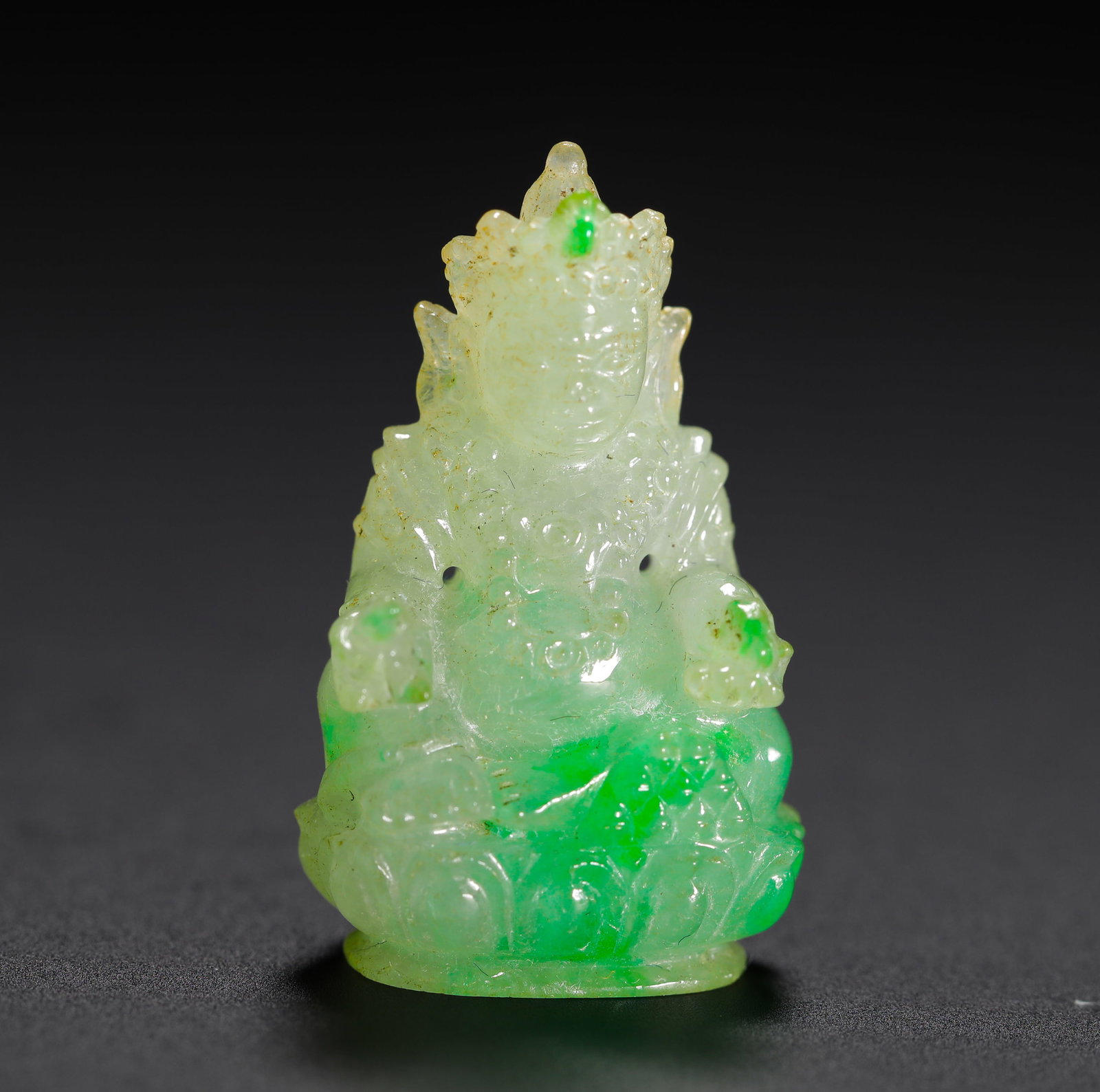 QING DYNASTY ICE TYPE FLOATING ZHENGYANG GREEN JADEITE YELLOW WEALTH GOD'S BODY FIGURE: H:2.4cm (0.94in) W:1.5cm (0.59in) Weight:4g (0.01lb)Qing icy jadeite small seated statue of Yellow Jambhala, vivid emerald green on lotus base & limbs, portable Tibetan Buddhist amulet.