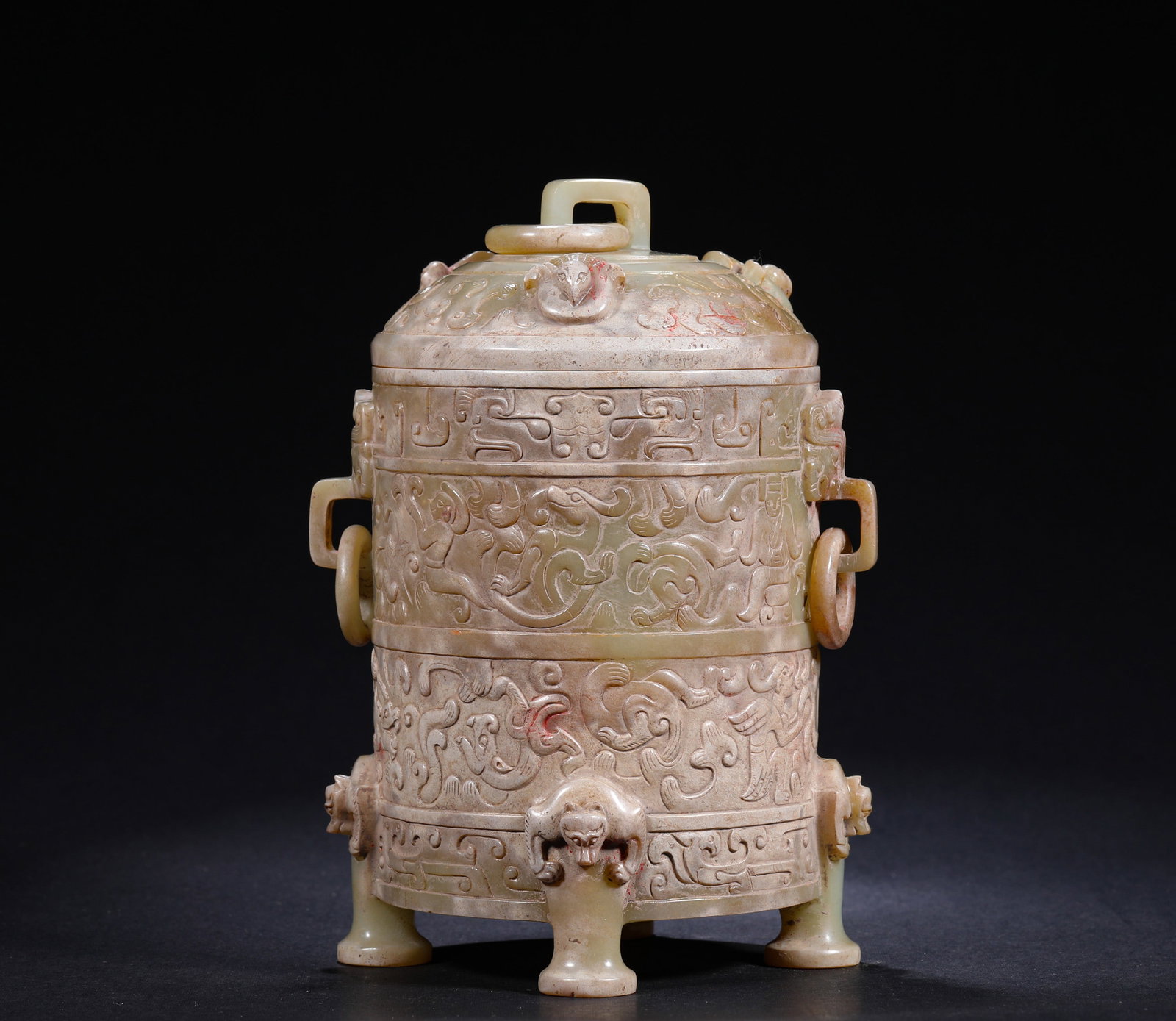 ANCIENT HAN DYNASTY JADE DRAGON-PATTERNED CAP VASE: H:16cm(6.30in) W:11cm(4.33in) Weight:670g(1.48lb)This is an ancient jade covered zun with full chi dragon carvings, beast-shaped feet, double ears and loose rings, featuring bluish-brown calcified jad