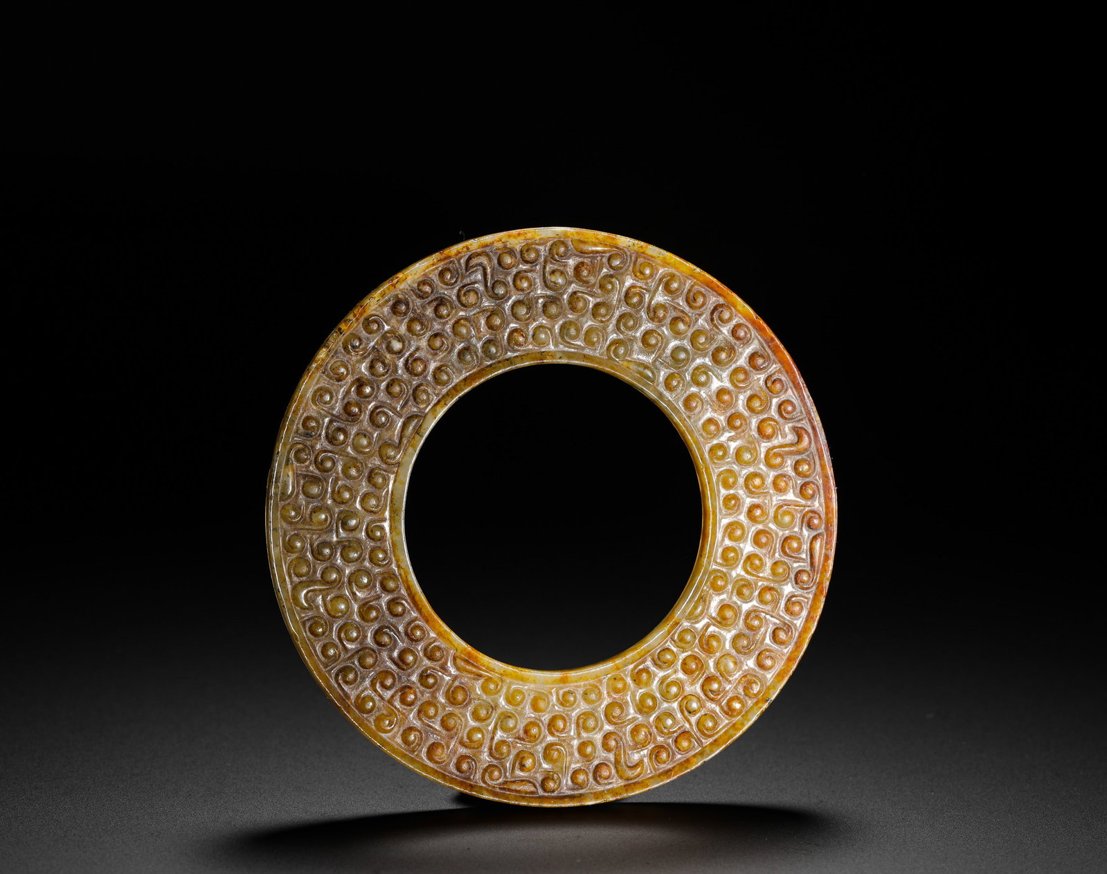 A MANQIN GRAIN PATTERN JADE DISC FROM THE WARRING STATES PERIOD (1 of 10)