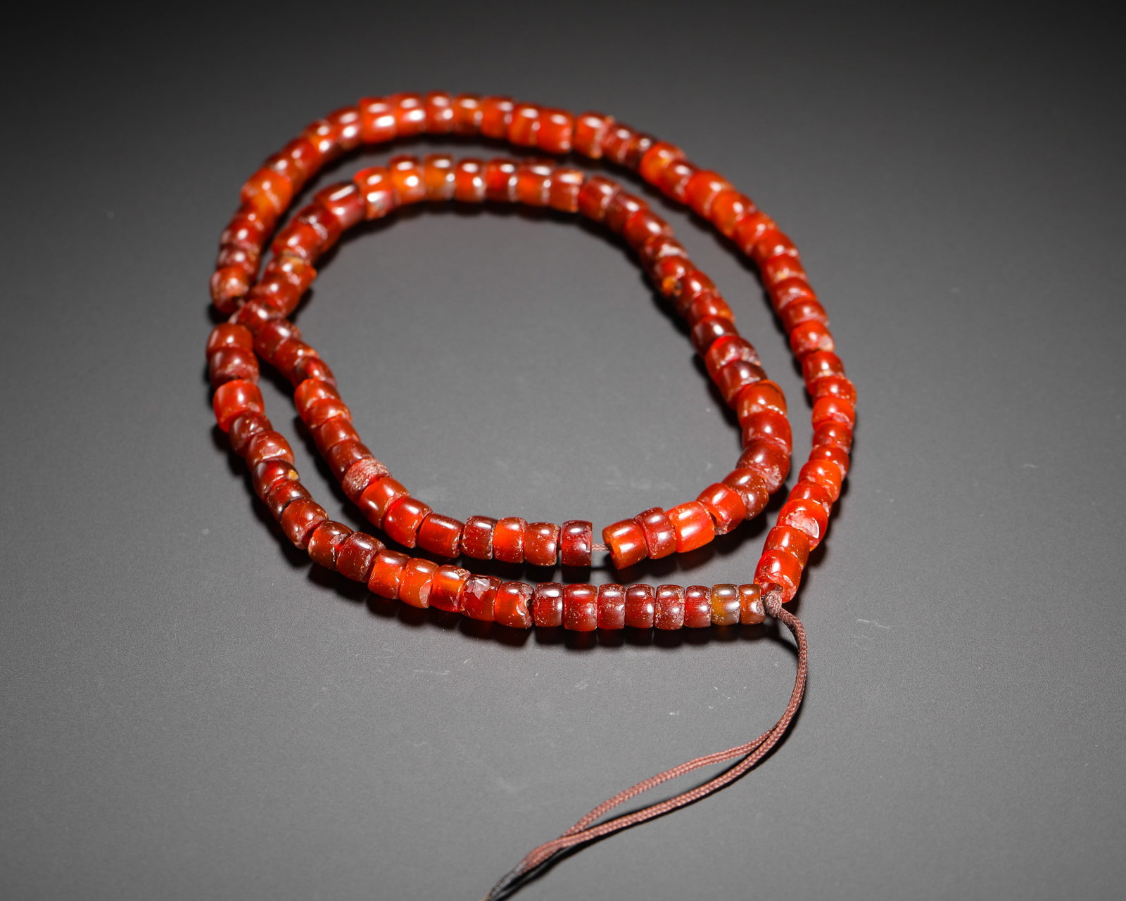 A STRING OF RED AGATE BEADS FROM THE SHANG AND ZHOU DYNASTIES (1 of 10)