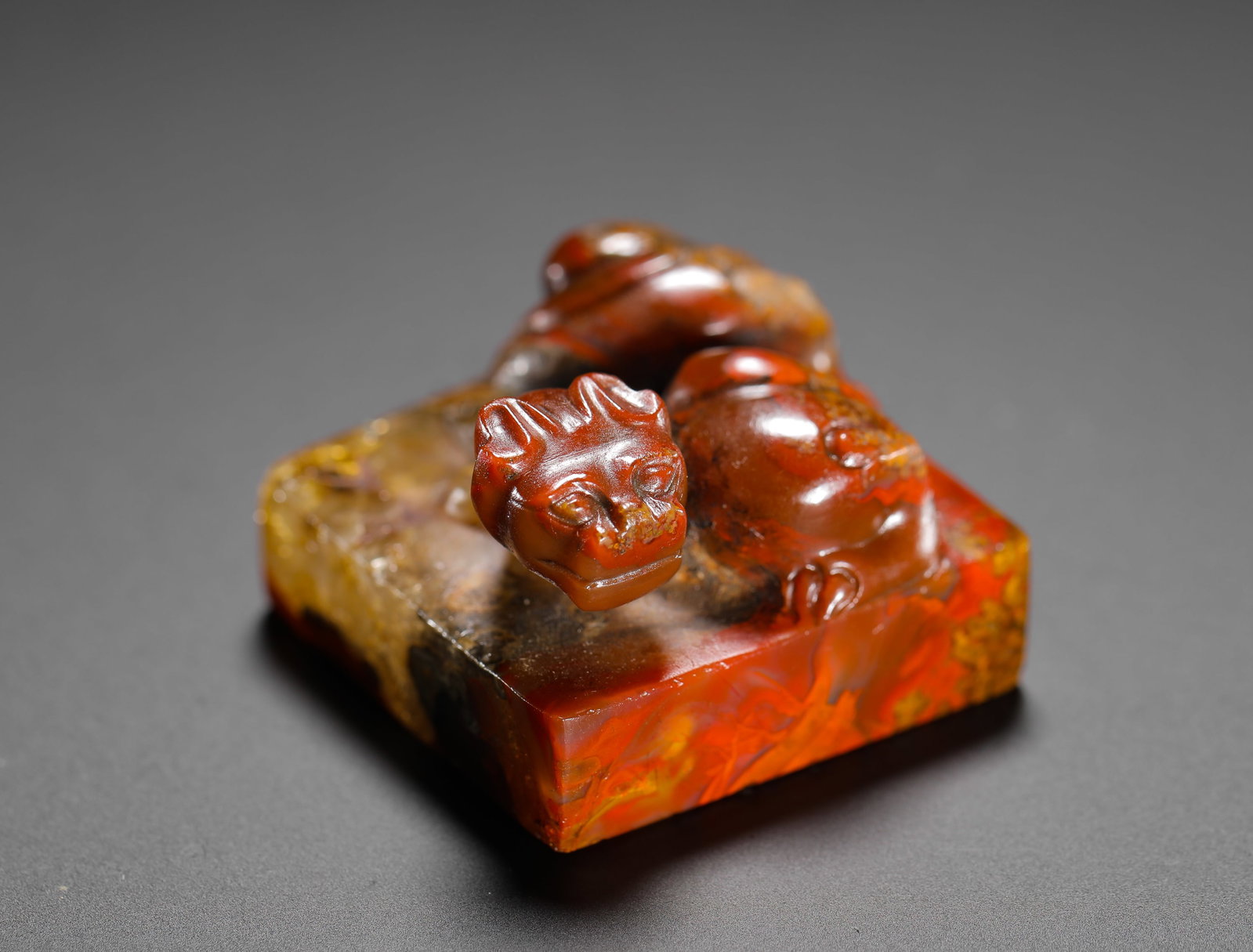 RED ONYX COILED DRAGON BUTTON SQUARE SEAL FROM THE WARRING STATES PERIOD (1 of 10)