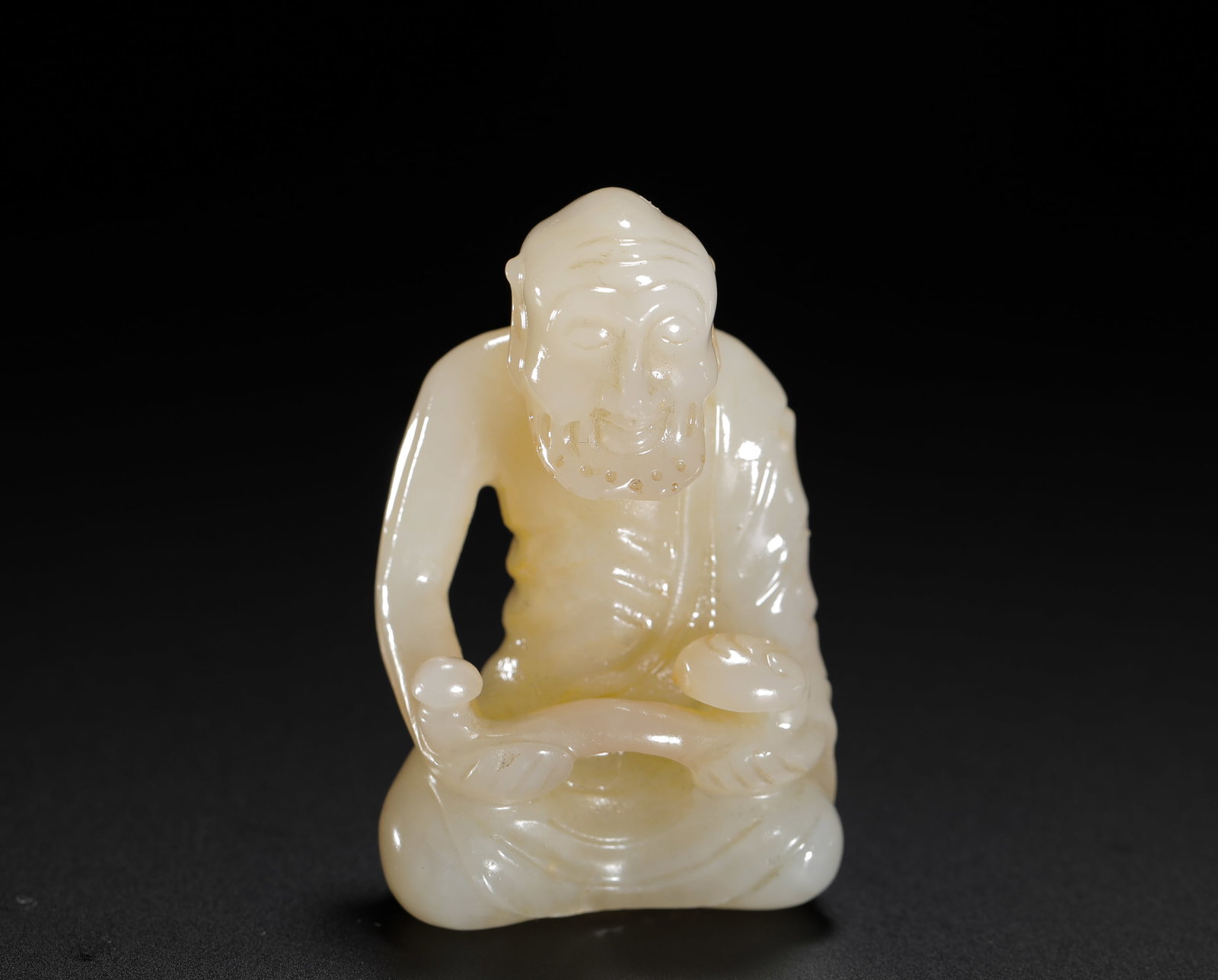 A SITTING STATUE OF THE RUYI ARHAT HELD BY TIAN BAIYU OF THE QING DYNASTY (1 of 9)