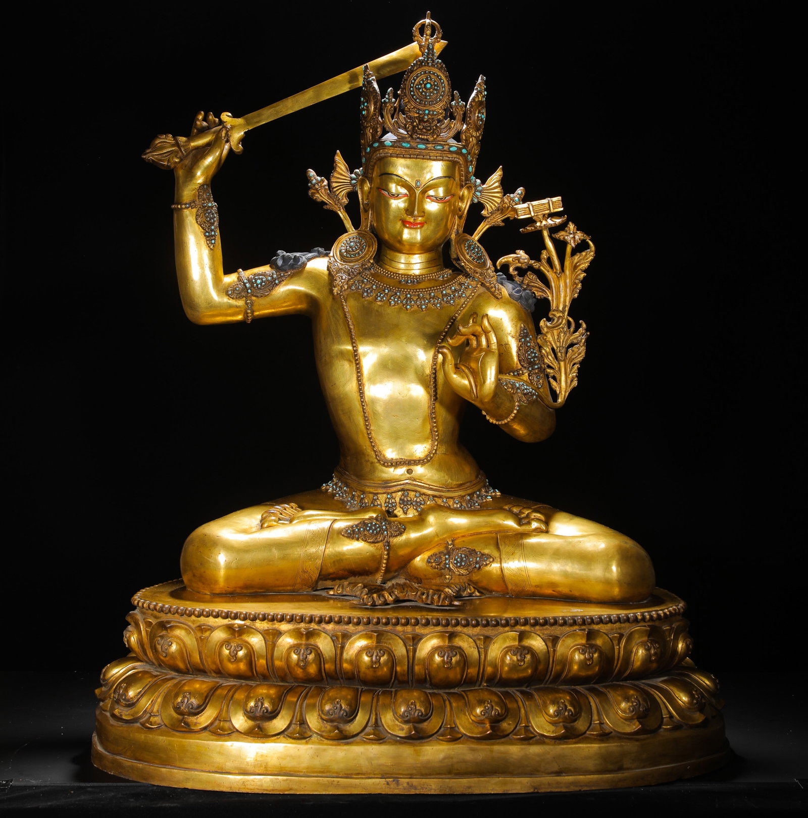 A GILDED BRONZE STATUE OF MANJUSRI BODHISATTVA INLAID WITH TURQUOISE FROM THE QING DYNASTY (1 of 15)