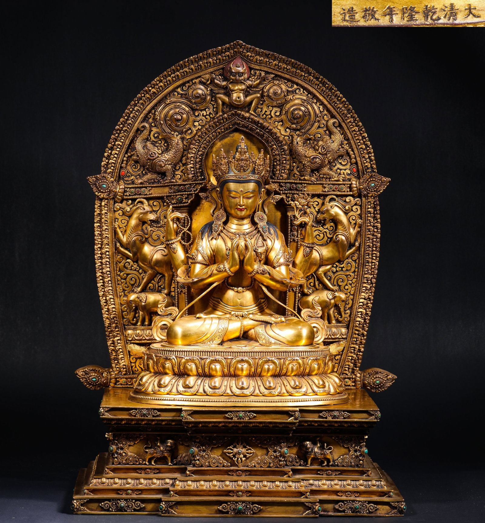 IN THE REIGN OF EMPEROR QIANLONG OF THE QING DYNASTY, A GILDED BRONZE SITTING STATUE OF GUANYIN WITH: H:80cmW:50cmWeight:30100g This is a gilt-bronze seated statue of Four-Armed Avalokiteshvara, marked with "Made respectfully in the Qianlong reign of the Great Qing Dynasty", a fine imperial Tibetan Bu