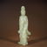 A QING DYNASTY CARVED WHITE JADE GUANYIN STATUE