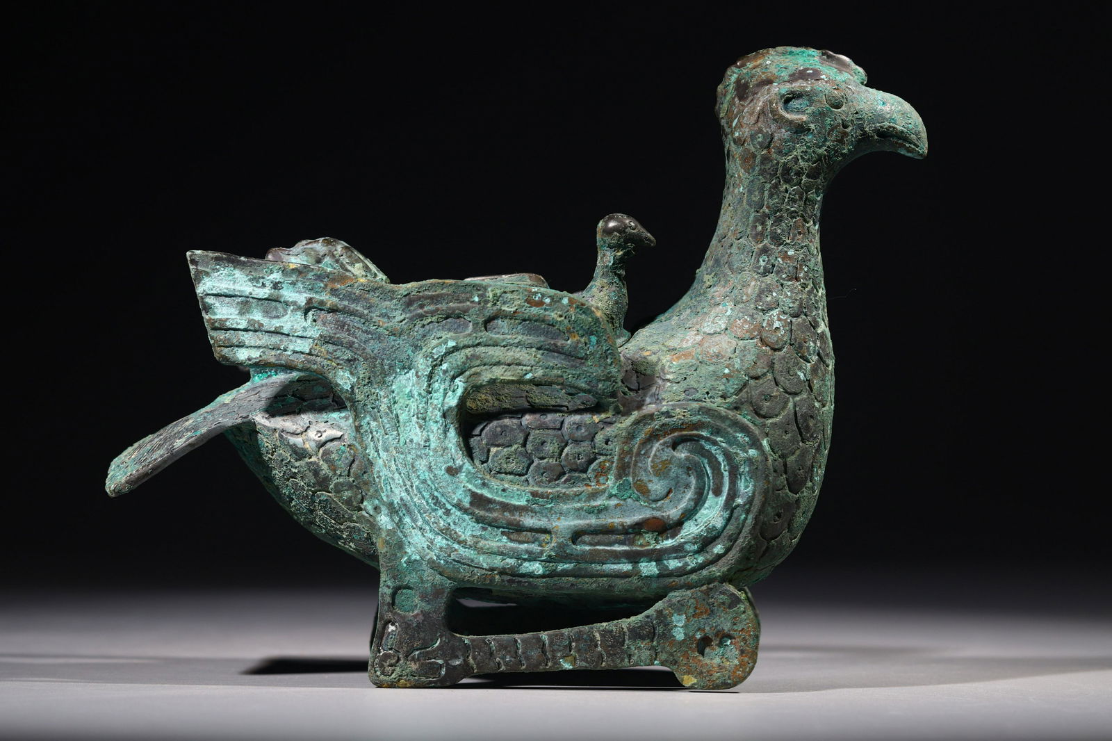A WARRING STATES PERIOD BRONZE PHOENIX ORNAMENT (1 of 9)