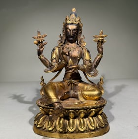 QING DYNASTY GILT FOUR-ARMED BODHISATTVA