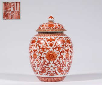 A fan-red jar with twig and flower lid, Qing Dynasty, China