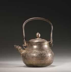 A kui-dragon patterned loop-handled silver pot,Qing Dynasty,China