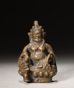 A copper alloy yellow Jambhala statuette,Qing Dynasty,China
