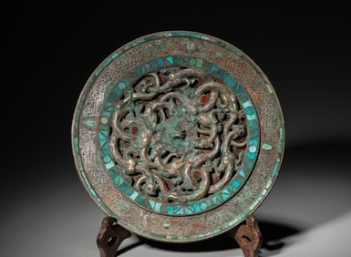 A gem-inlaid kui dragon patterned bronze mirror,Han Dynasty,China
