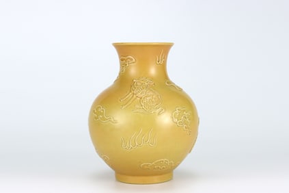 QING DYNASTY YELLOW GLAZE CARVED ANIMAL PATTERN BOTTLE