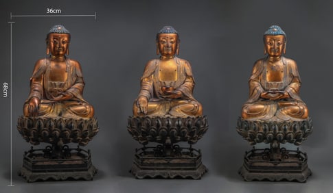 A MING DYNASTY GILDED BRONZE FIGURE OF THE THREE TATHAGATAS